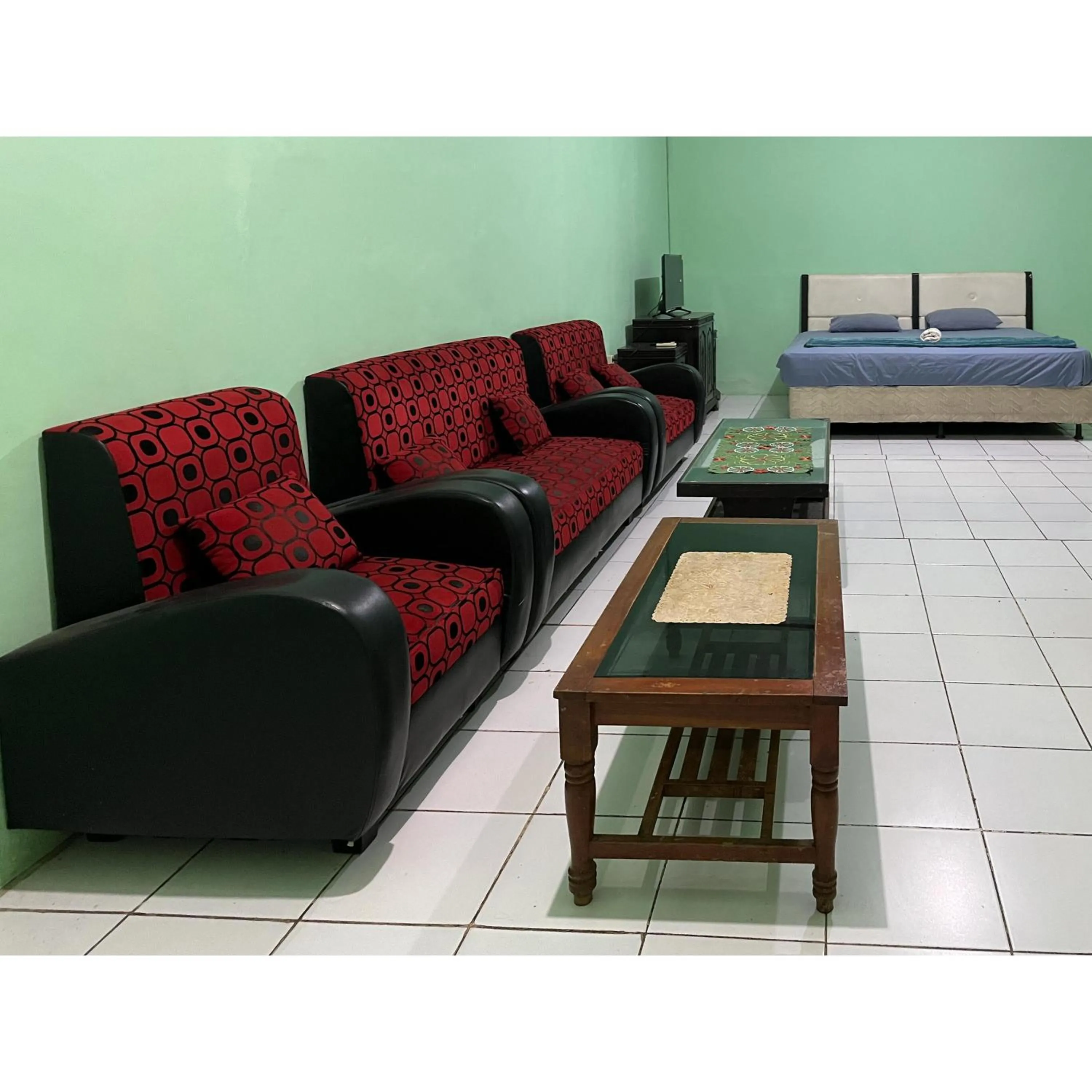 Seating area, Bed in Afiat Hotel Maros Makassar RedPartner