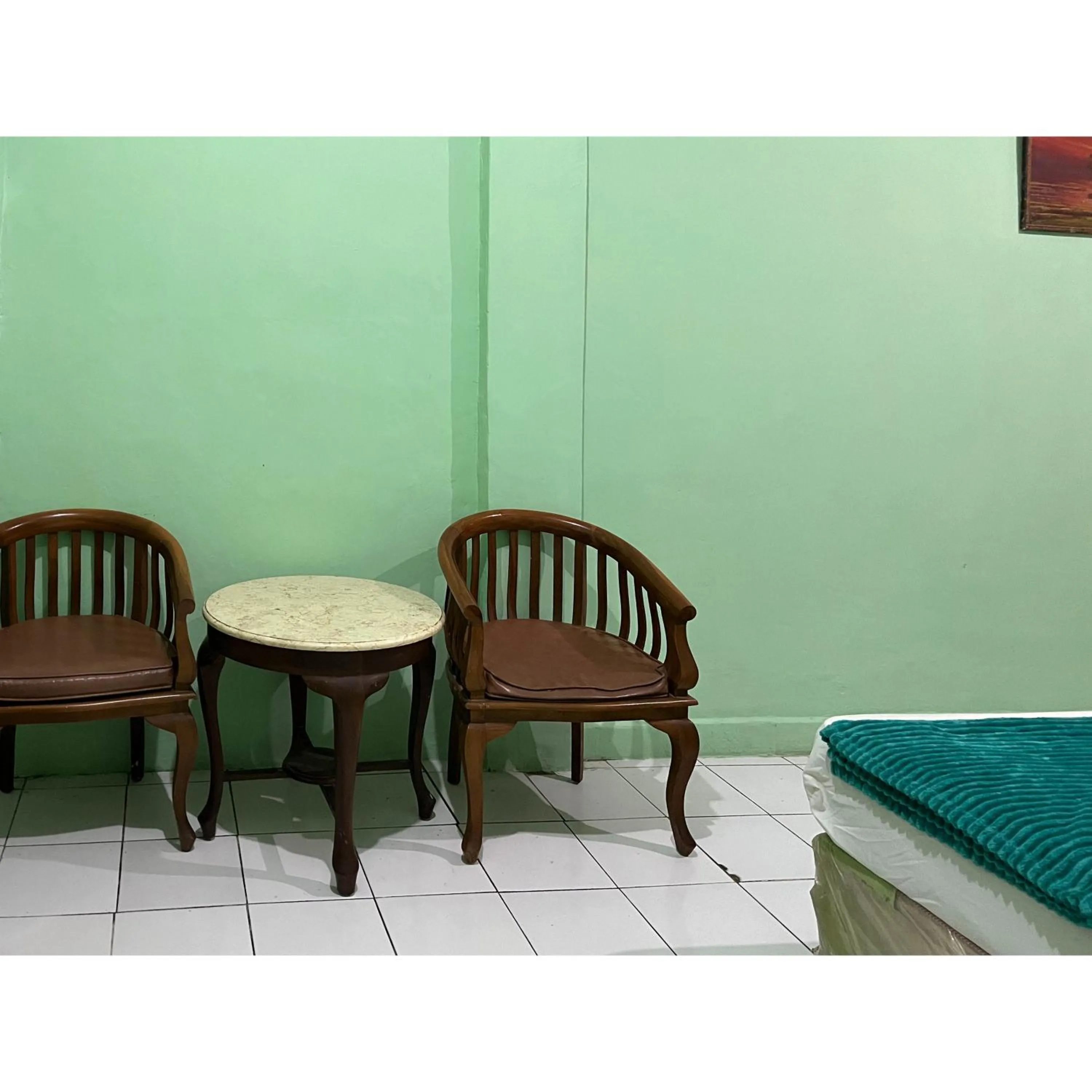 Seating area in Afiat Hotel Maros Makassar RedPartner