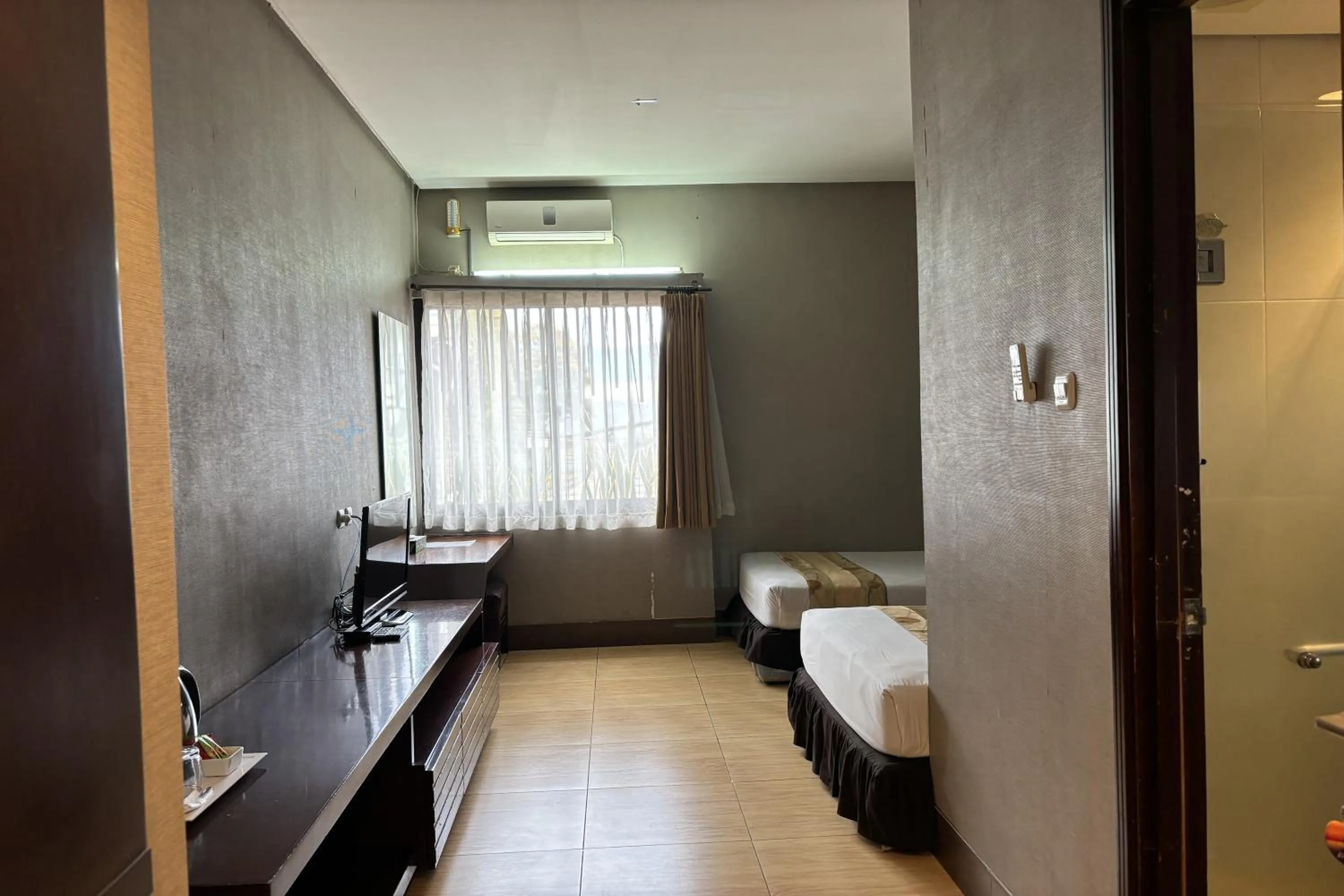 Bed in Hotel Pesona Bamboe Lembang