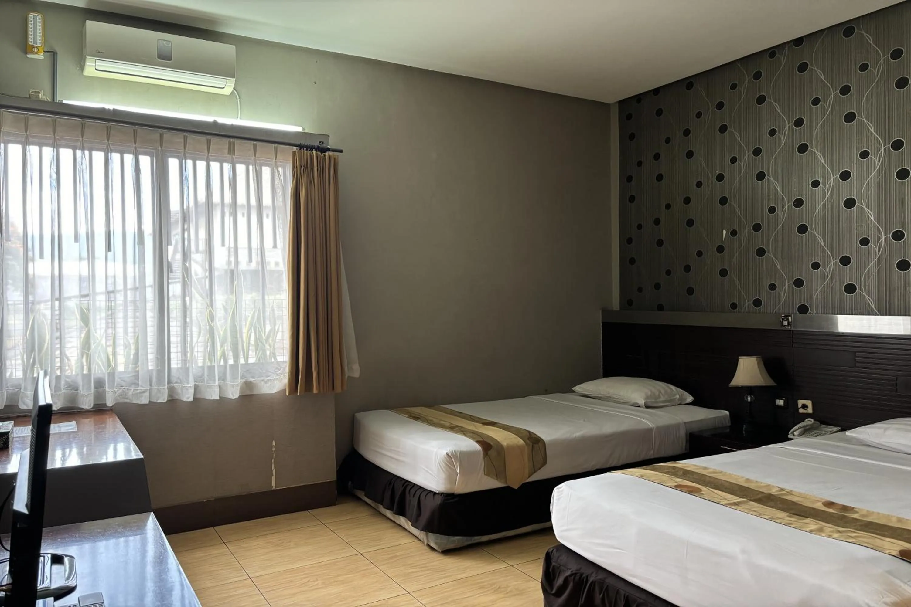 Bed in Hotel Pesona Bamboe Lembang