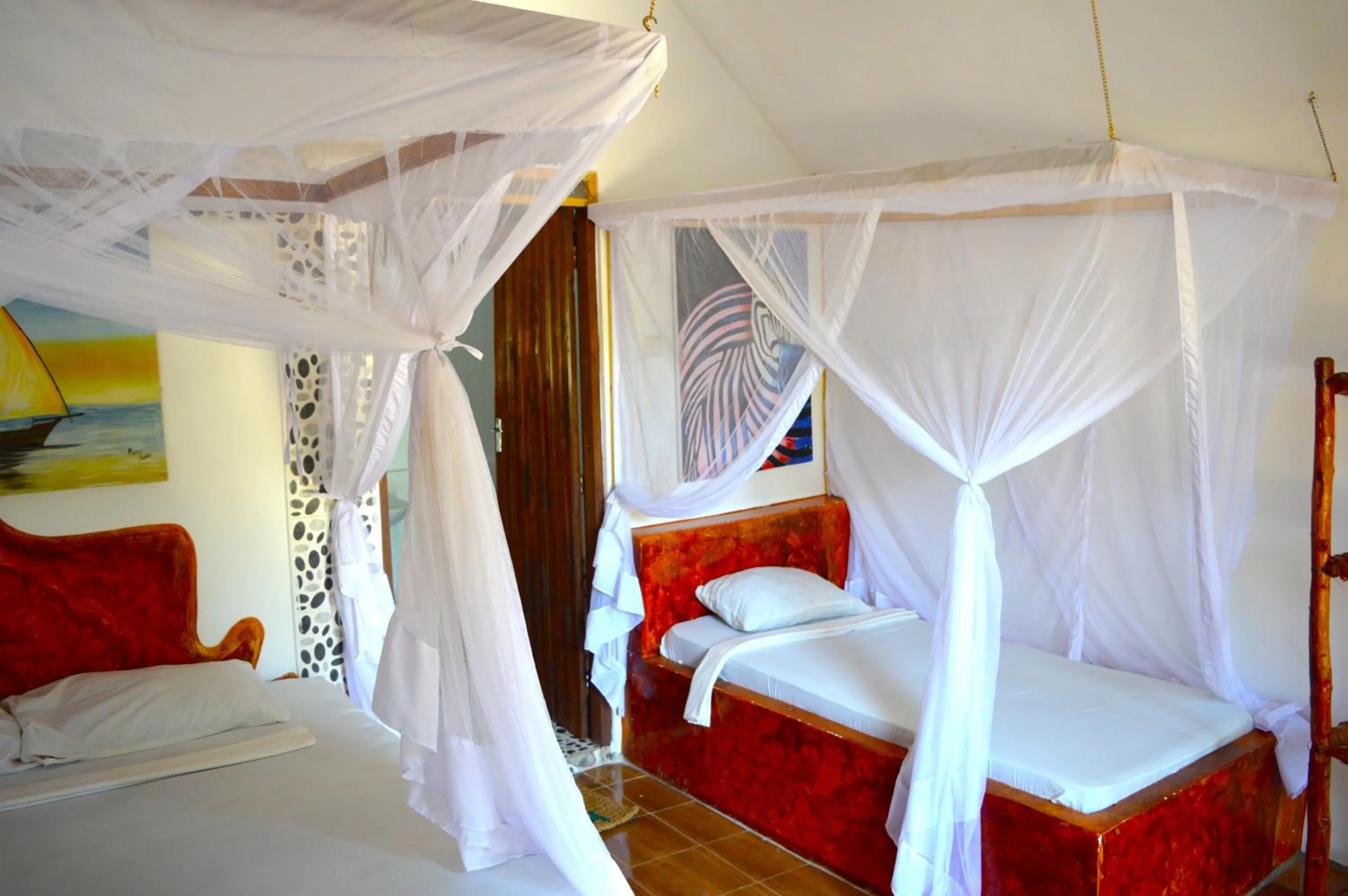 Bed in New Jambo Bungalows