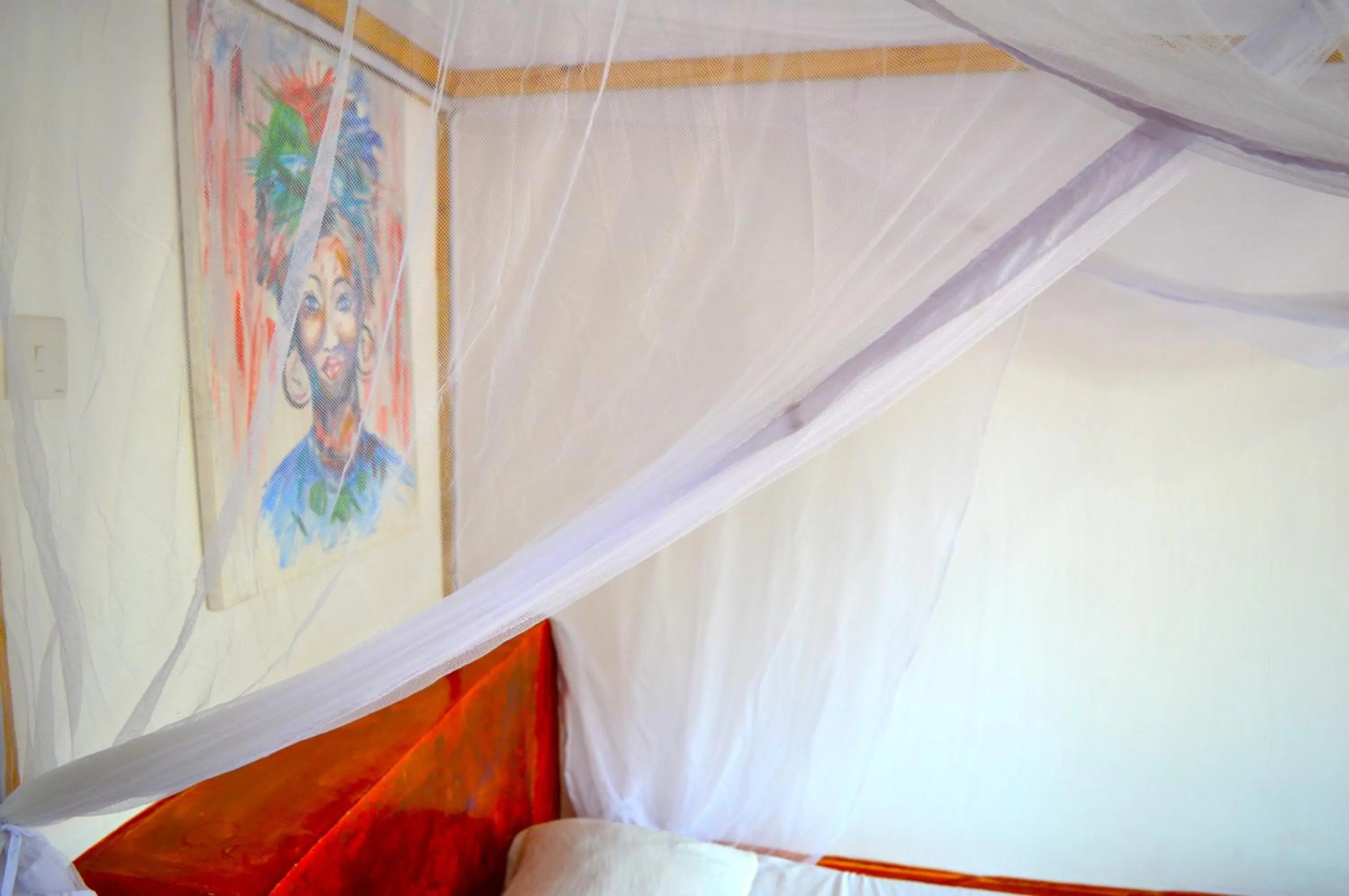 Bed in New Jambo Bungalows