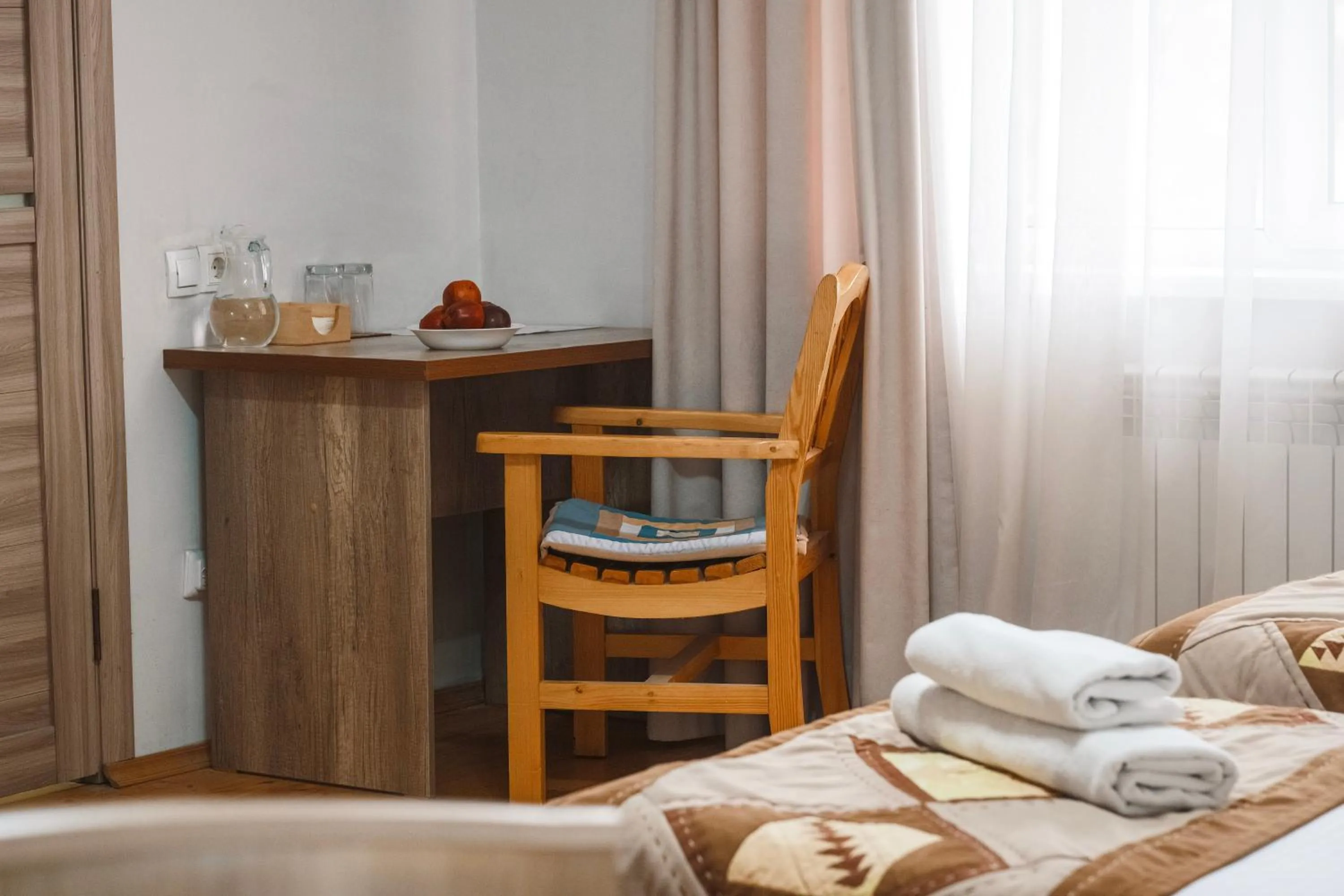 Seating area, Bed in TES Hotel