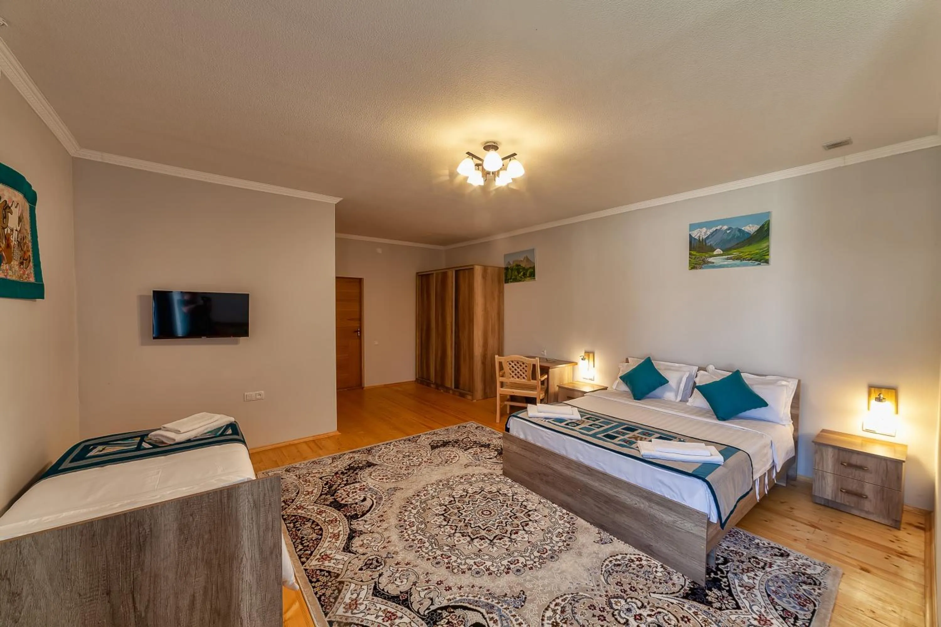 Communal lounge/ TV room, Bed in TES Hotel