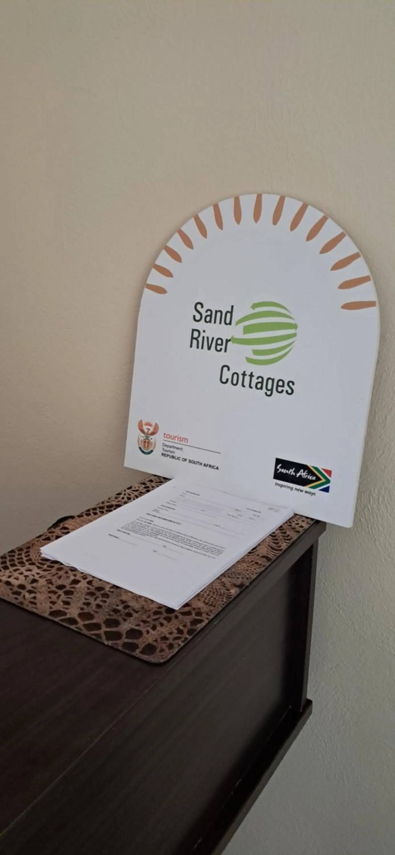 Logo/Certificate/Sign in Sand River Cottages
