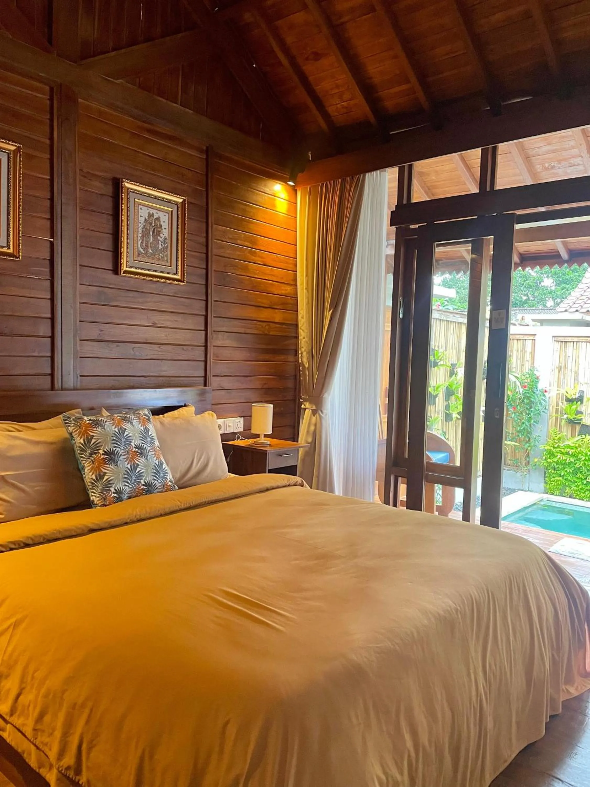 Bed in Ngesil Private Joglo & Pool