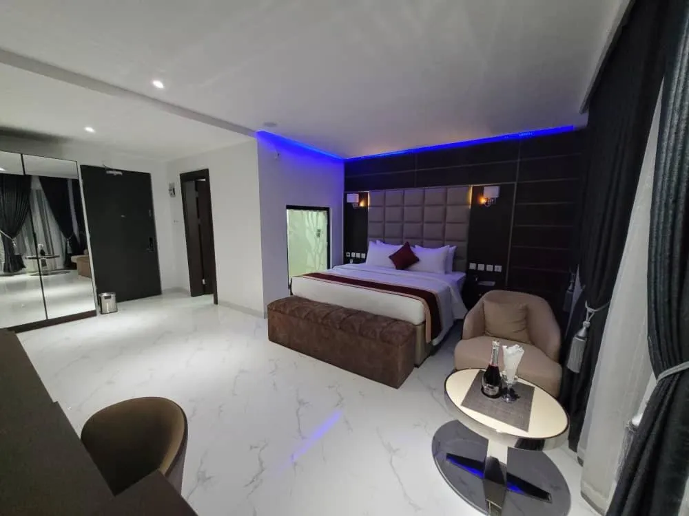 Bed in Carlton Swiss Luxury Residency