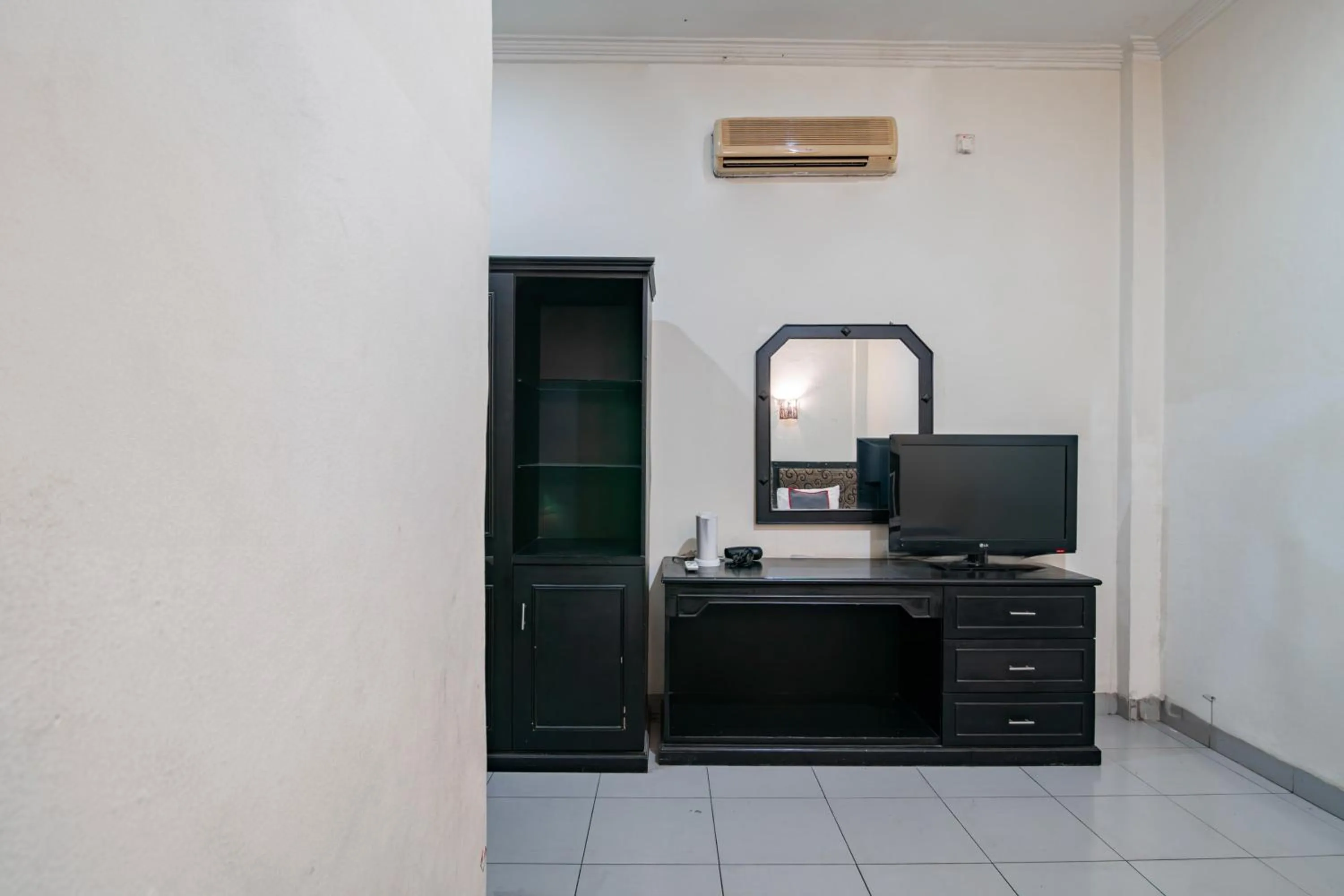 Bedroom in Collection O Senapelan Near Rsud Petala Bumi Formerly De Town Hotel