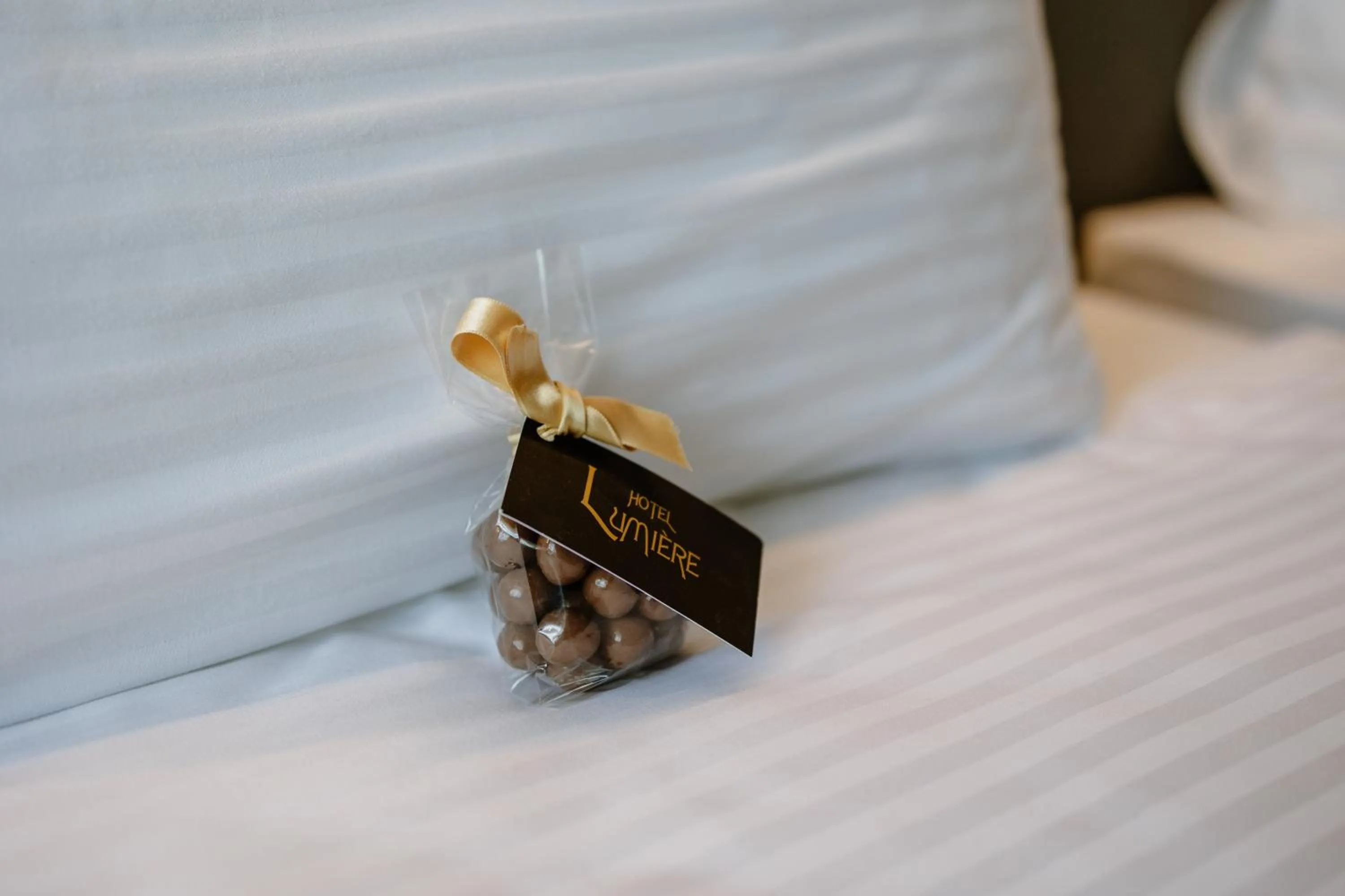 room service, Bed in Lumière Hotel Pool & SPA