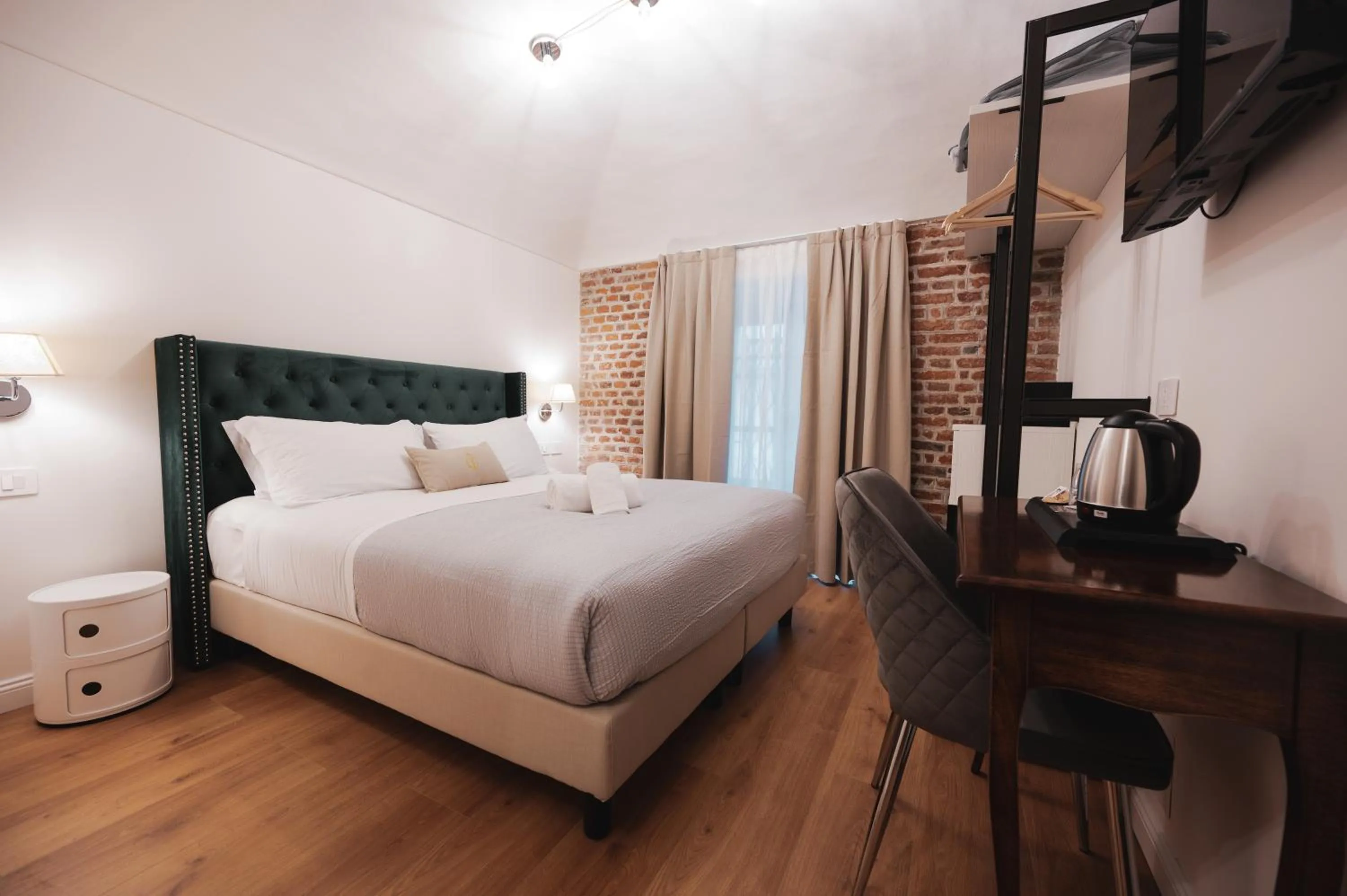 Bed in Carlo Felice Boutique Hotel