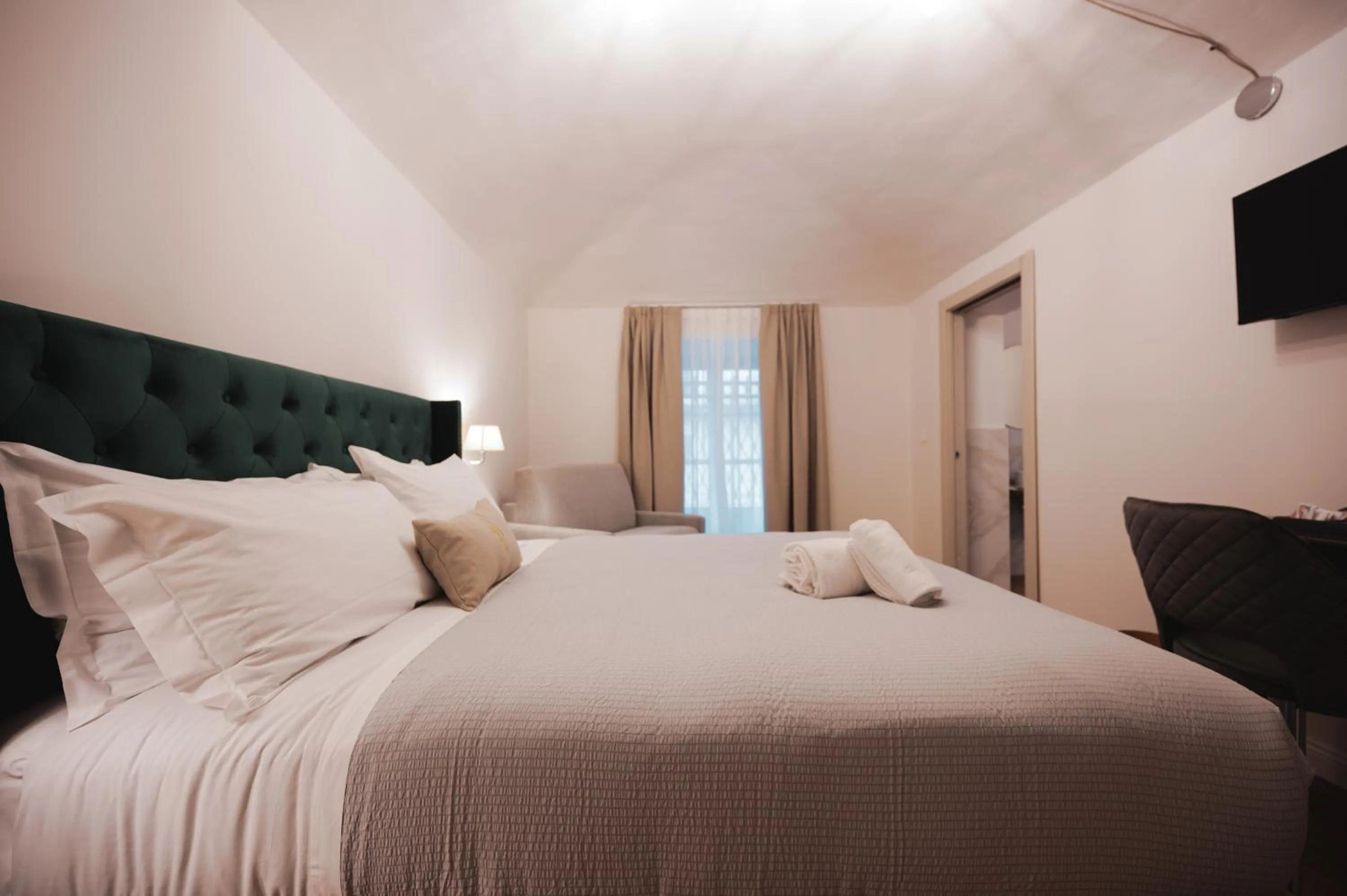 Photo of the whole room, Bed in Carlo Felice Boutique Hotel