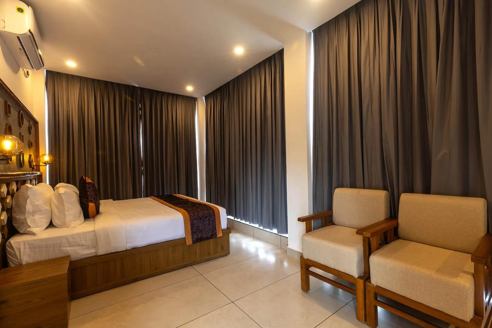 Bed in SandalMist Resort and Spa