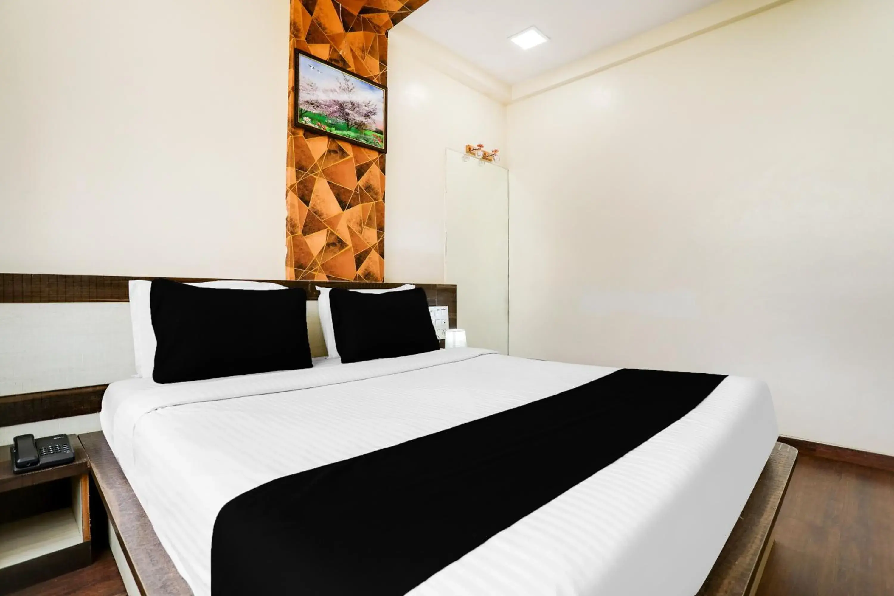 Bedroom, Bed in Super Hotel O Palkhi Road Near Sai Baba Temple Formerly Netra Sai Bedroom, Bed in Super Hotel O Palkhi Road Near Sai Baba Temple Formerly Netra Sai