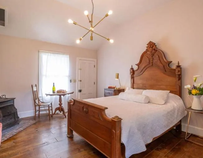 Bed in Dennen's Victorian Farmhouse