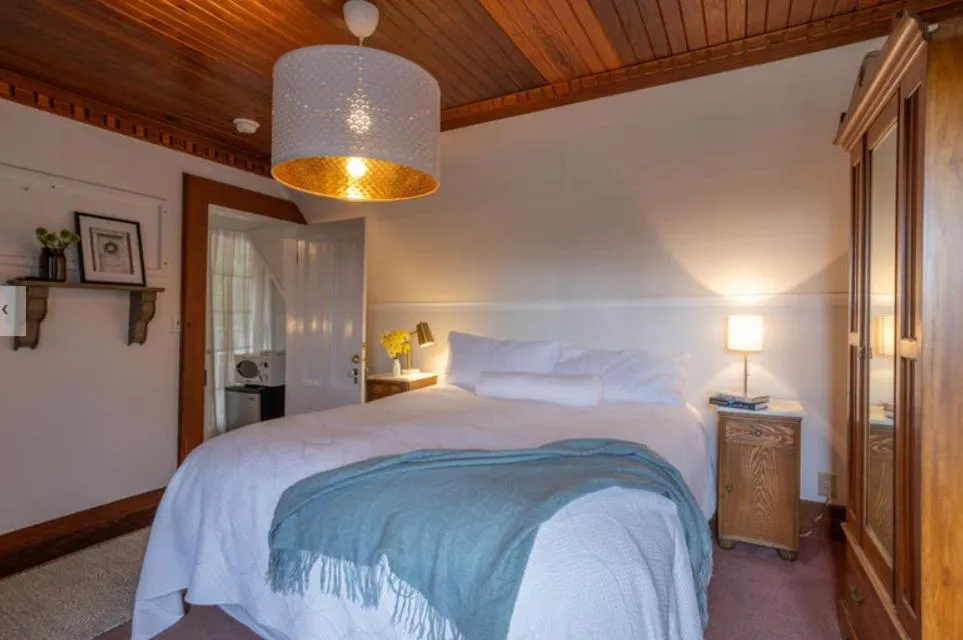 Bed in Dennen's Victorian Farmhouse