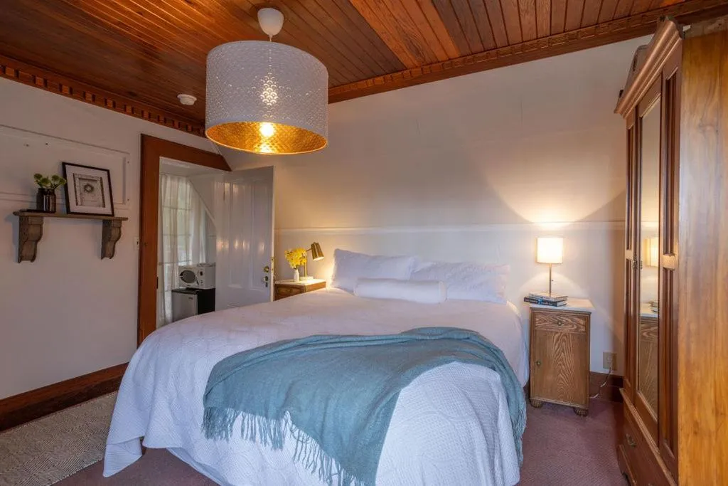 Bed in Dennen's Victorian Farmhouse