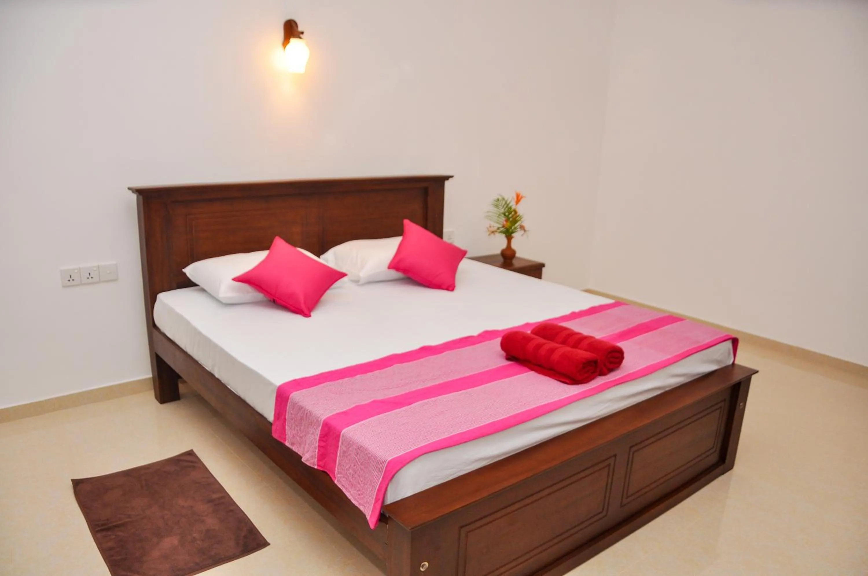 Bed in Hiru Resort Inn