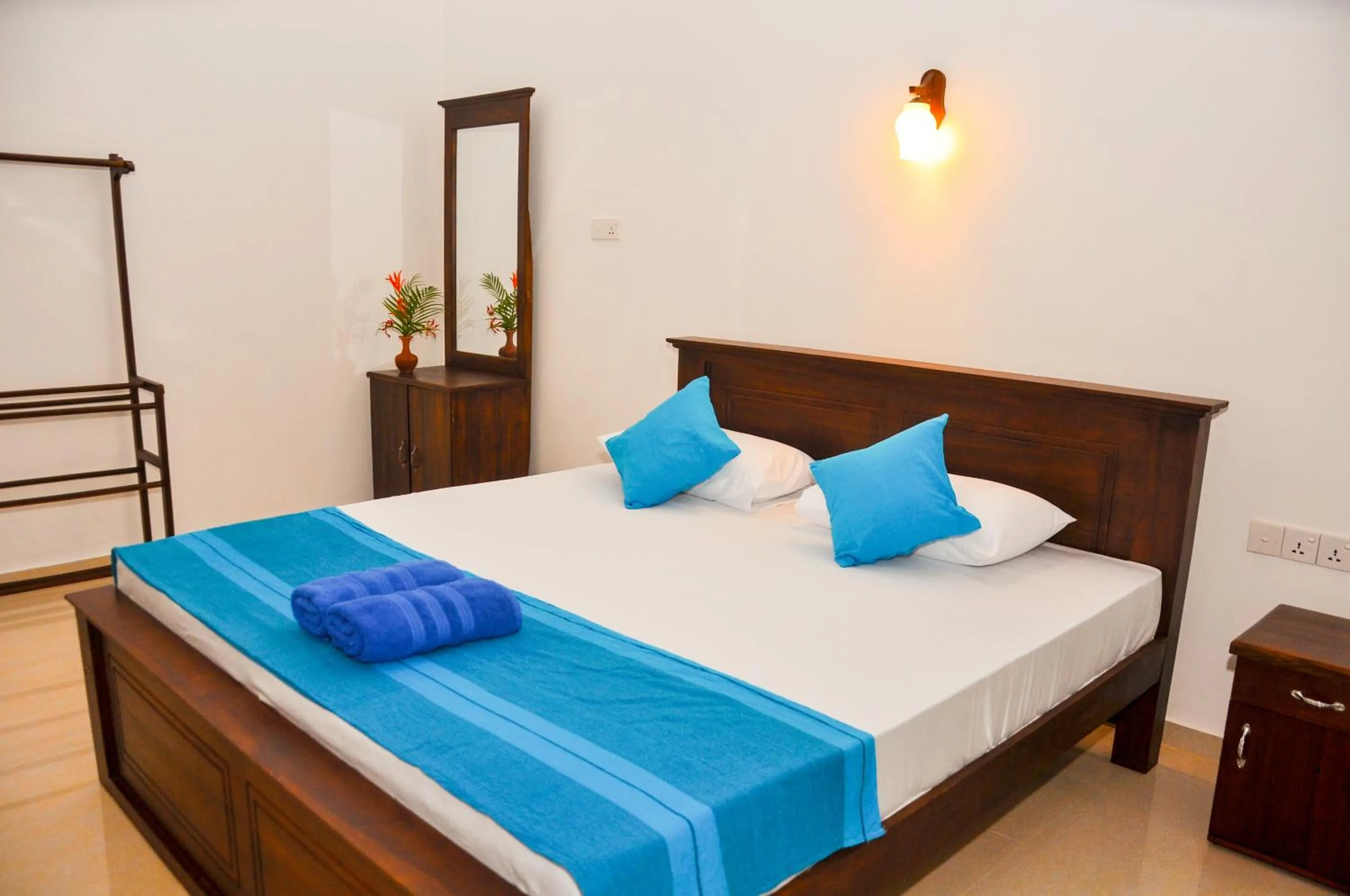 Bed in Hiru Resort Inn