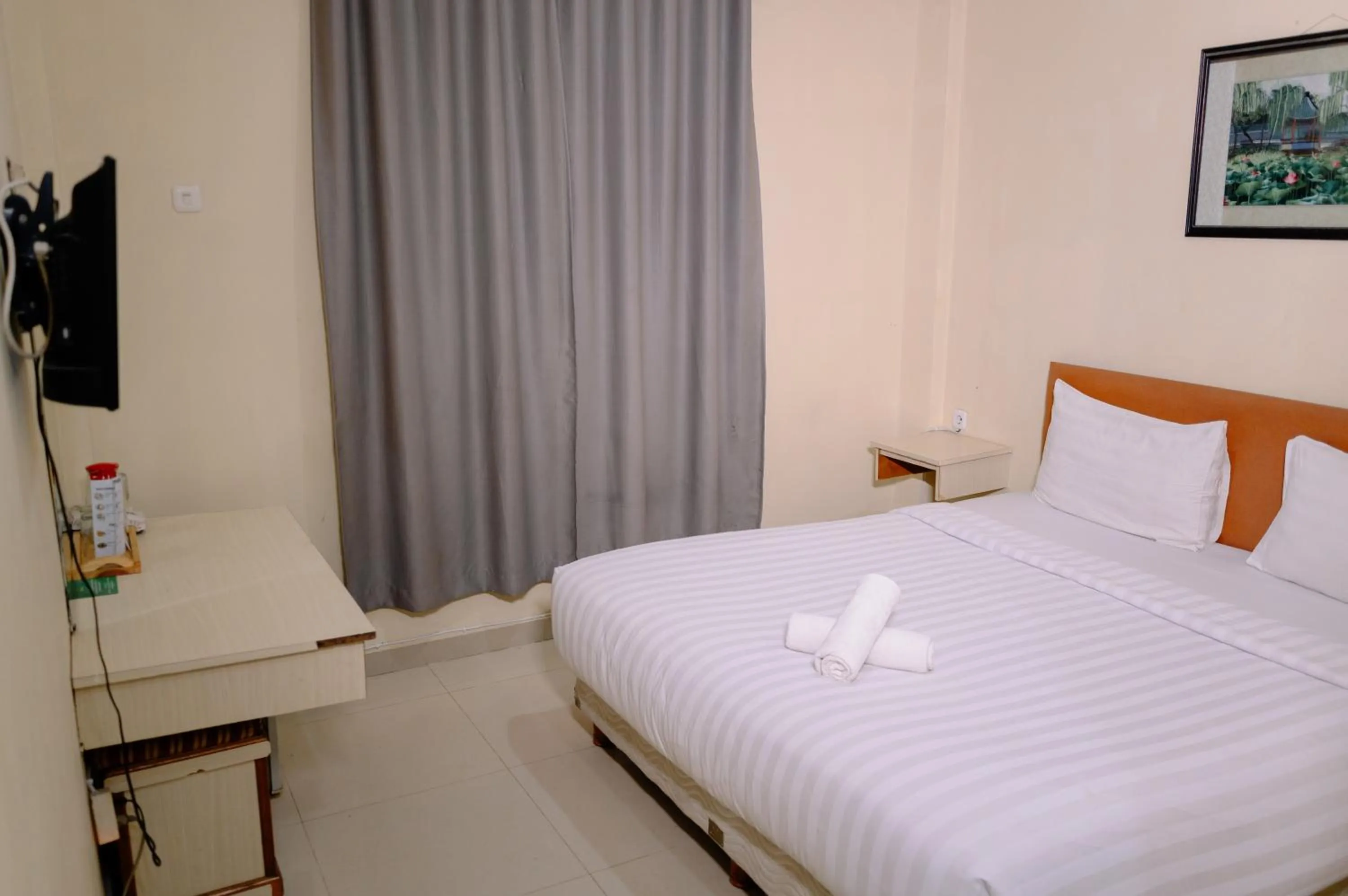 Bed in Kartika Sriwijaya Hotel