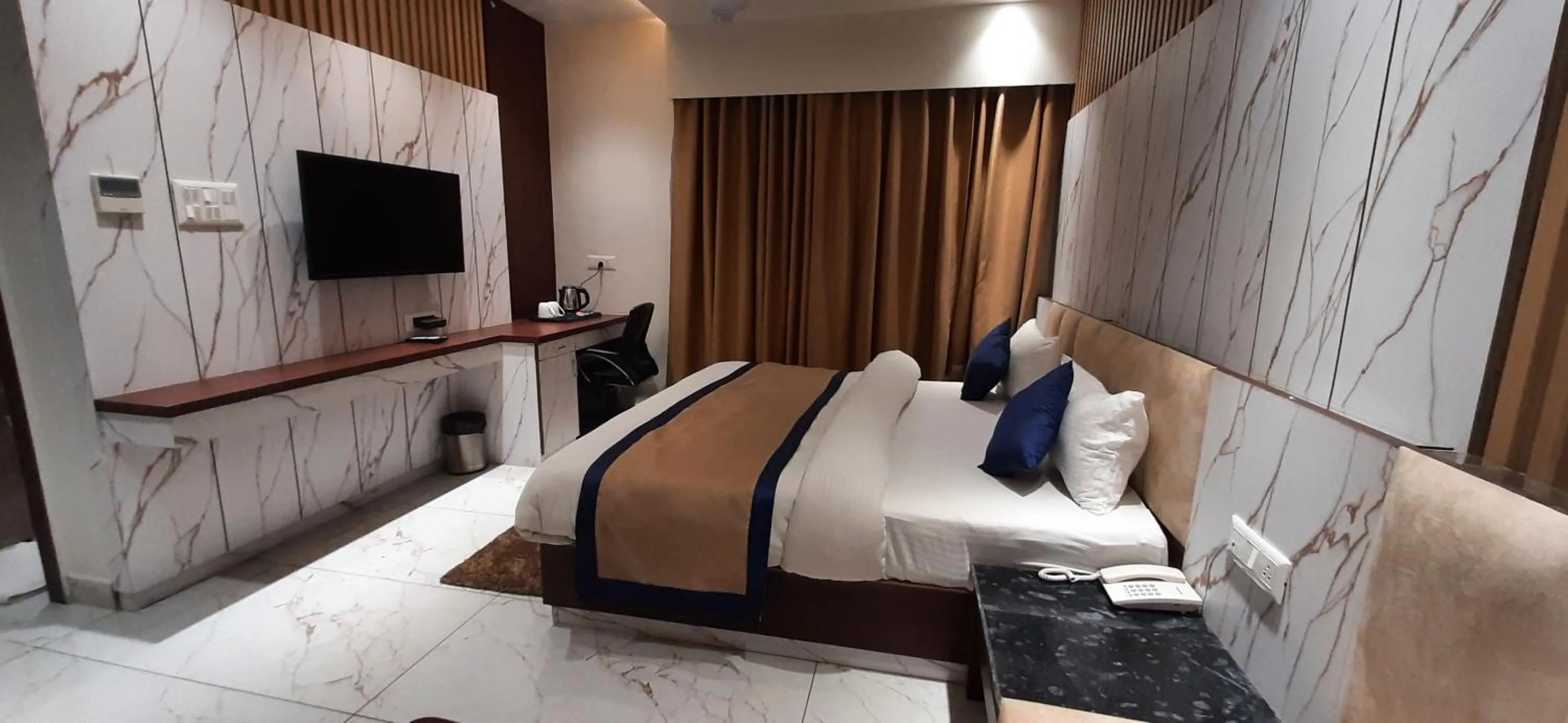 Bed in Sparsh Hotel & Resort