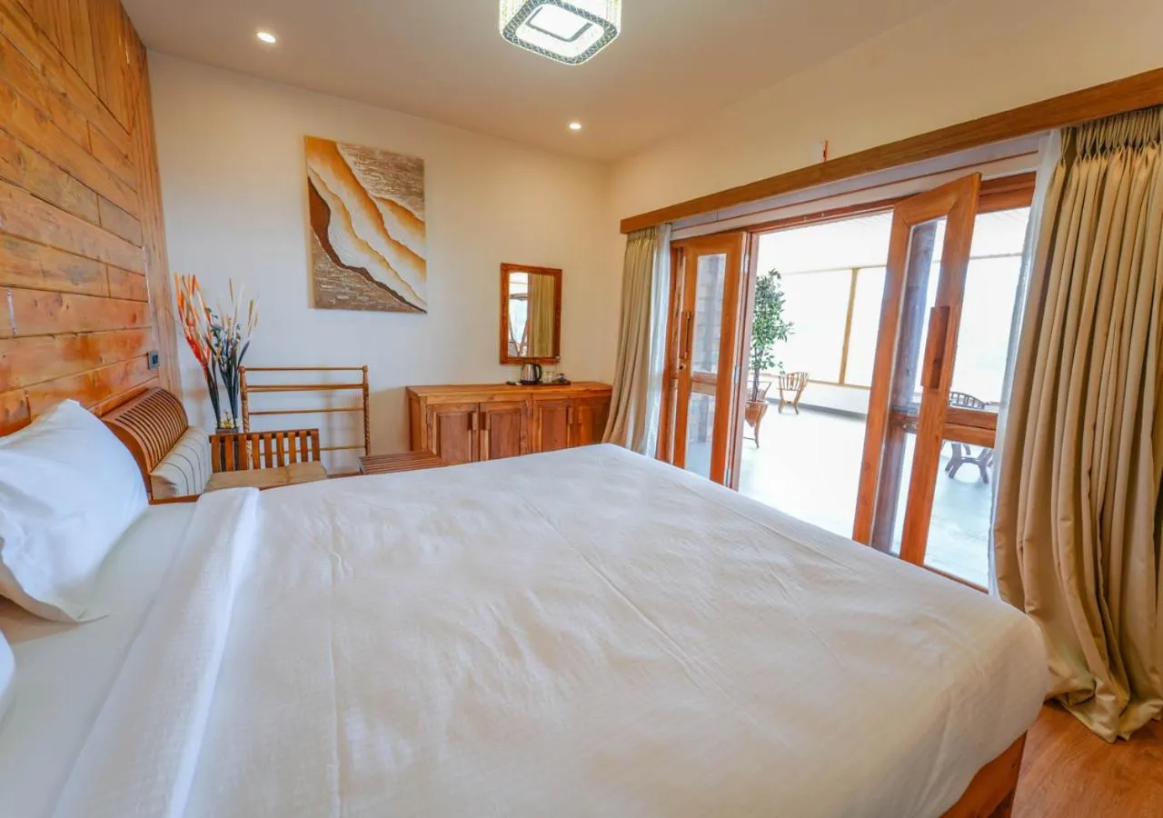 Bed in Silent Retreat Ooty Pool Resort by VOYE HOMES