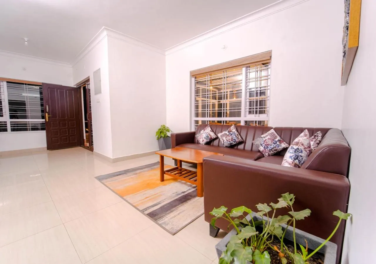 Living room in Silent Retreat Ooty Pool Resort by VOYE HOMES