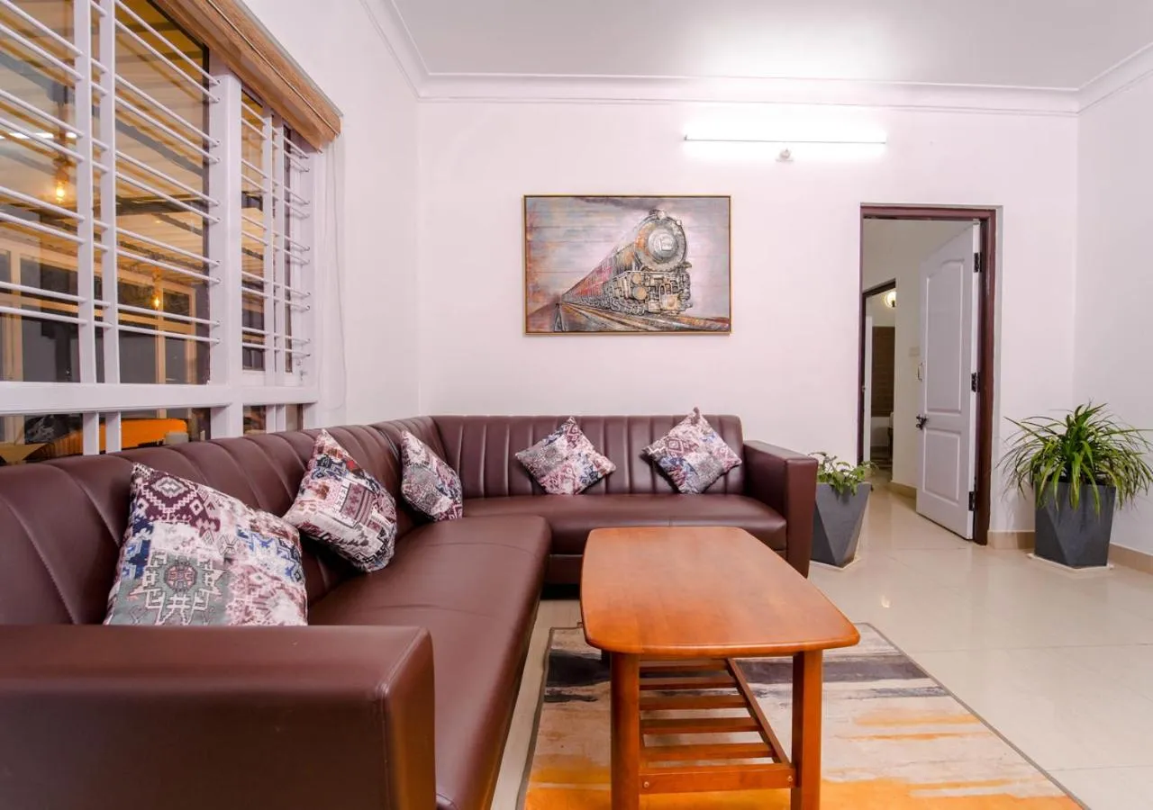 Living room in Silent Retreat Ooty Pool Resort by VOYE HOMES