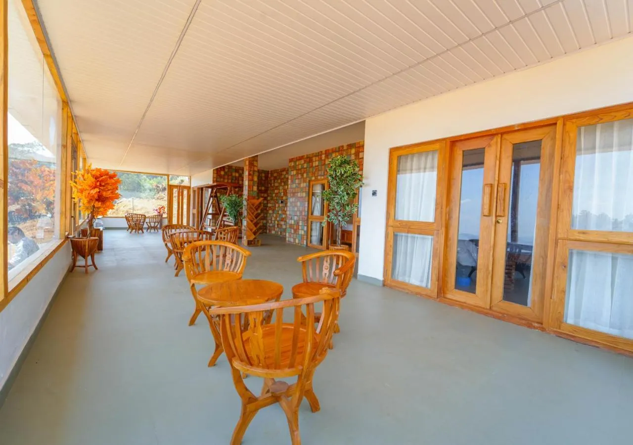 Living room in Silent Retreat Ooty Pool Resort by VOYE HOMES
