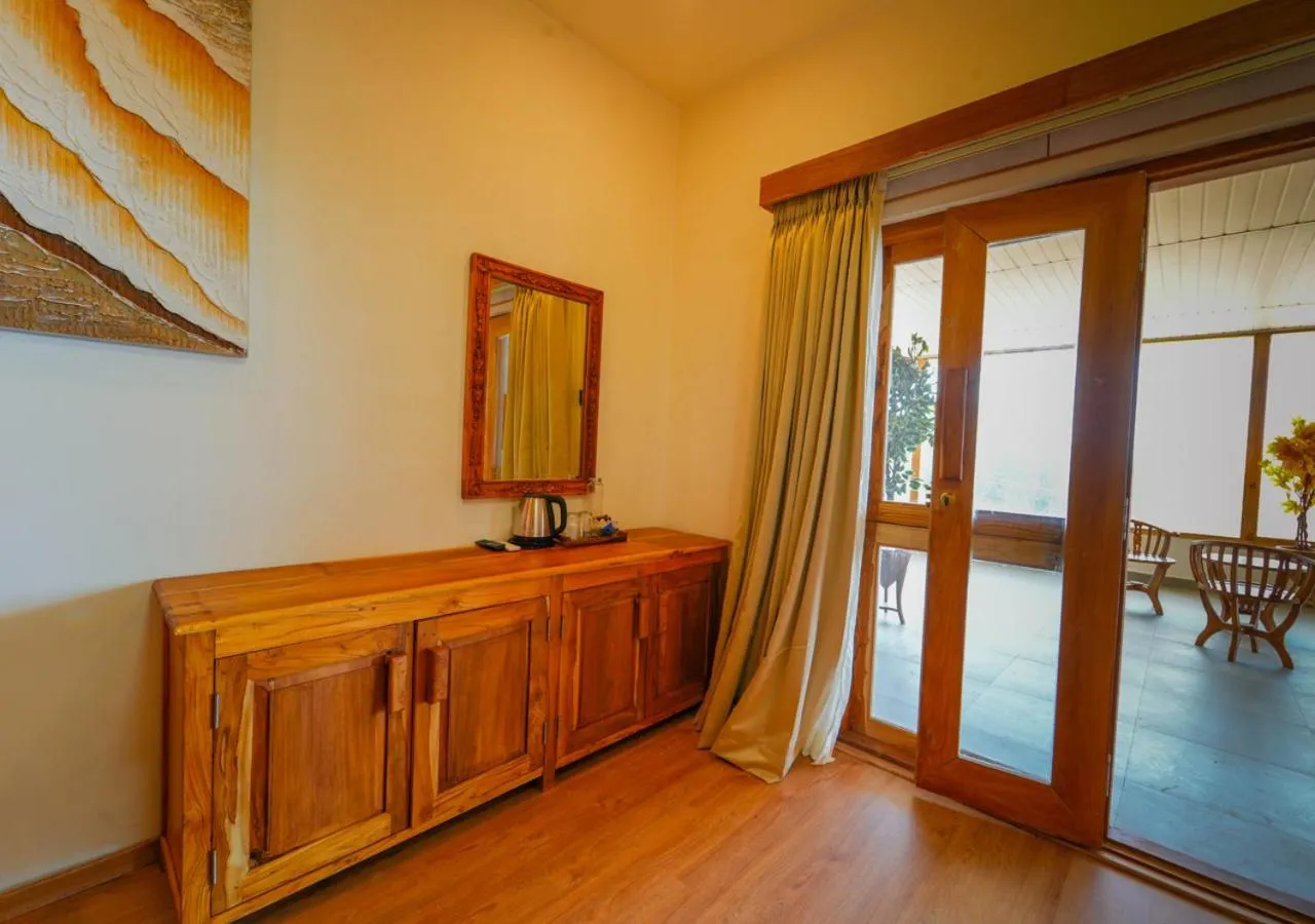 Seating area in Silent Retreat Ooty Pool Resort by VOYE HOMES