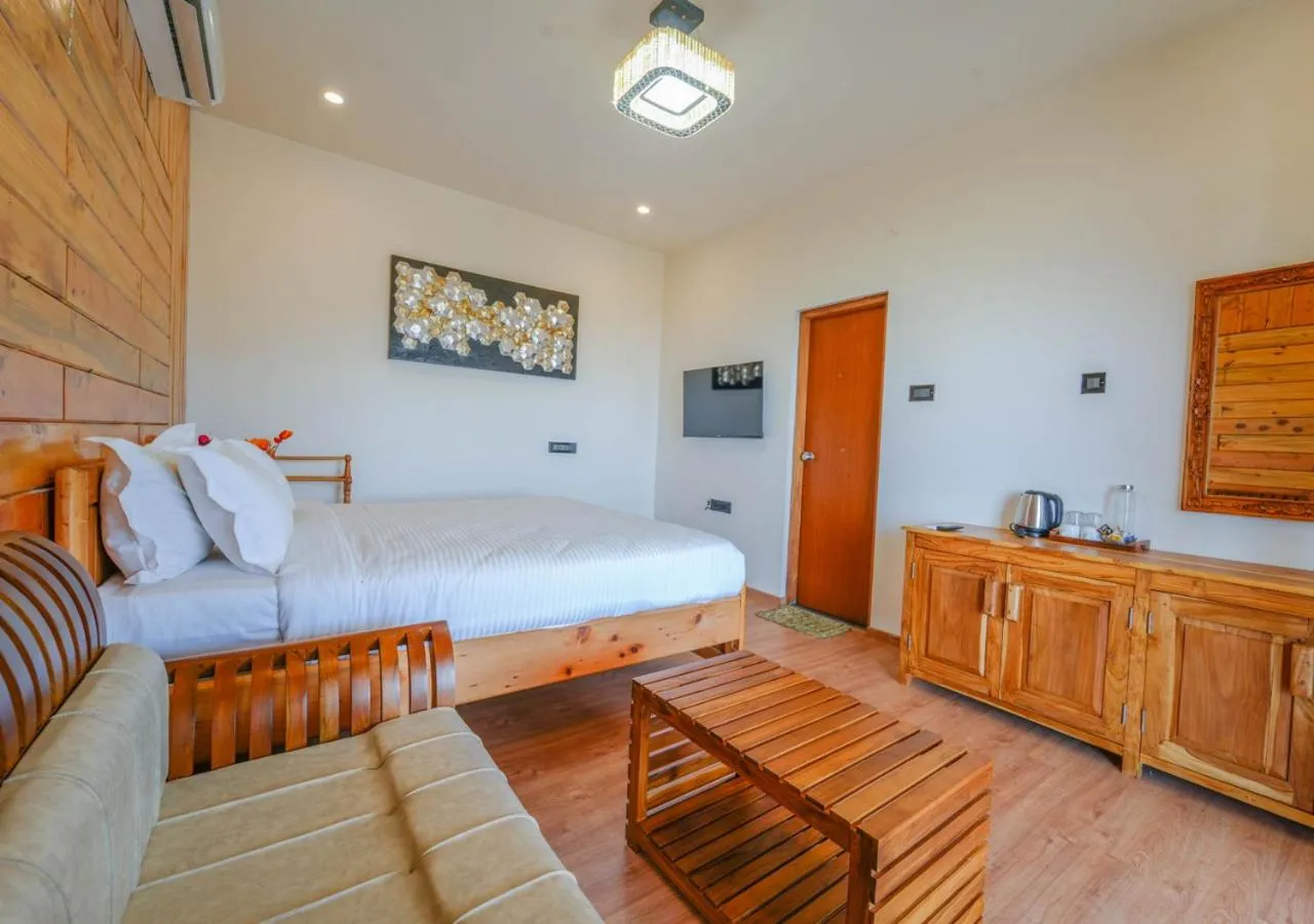 Bed in Silent Retreat Ooty Pool Resort by VOYE HOMES