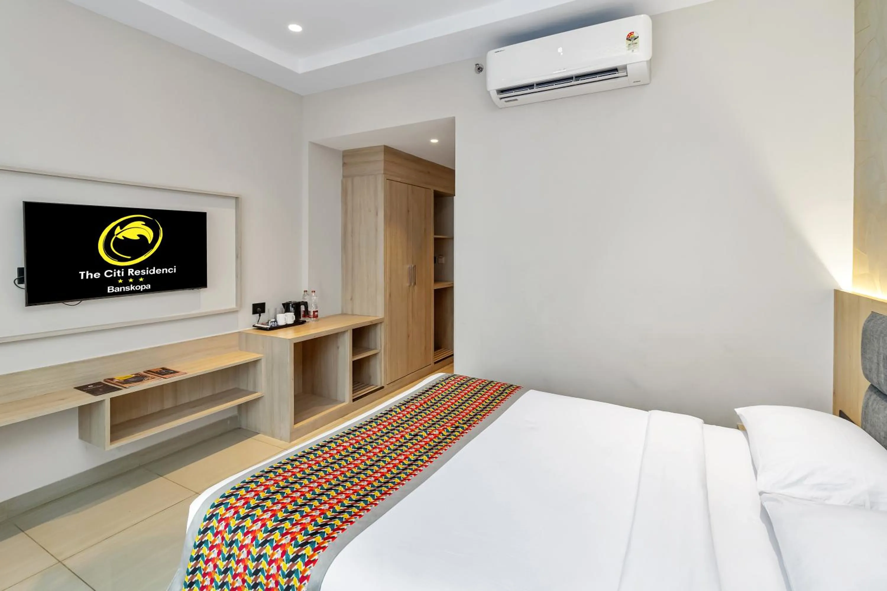 Bed in The Citi Residenci Hotel, Banskopa