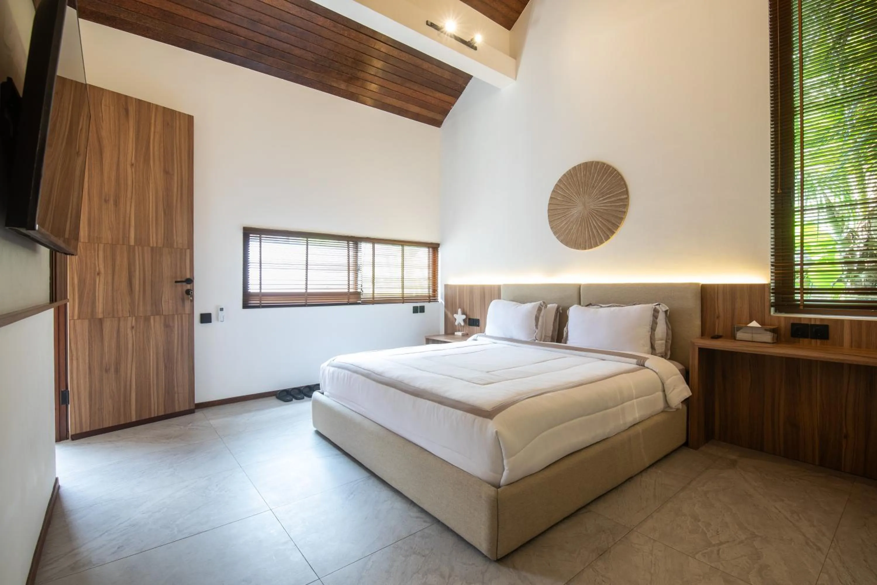 Bed in KammOra Living and Villas