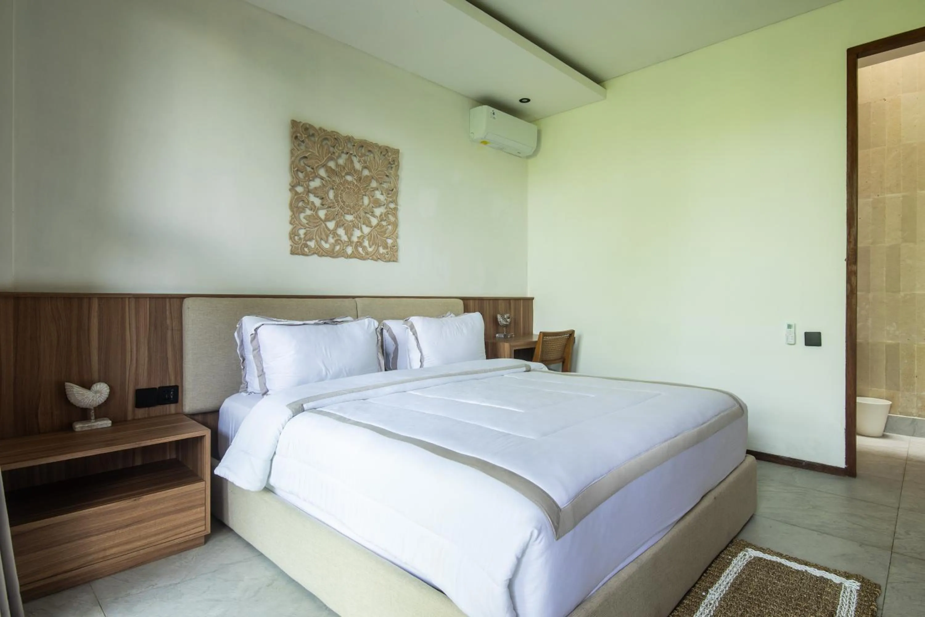 Bed in KammOra Living and Villas
