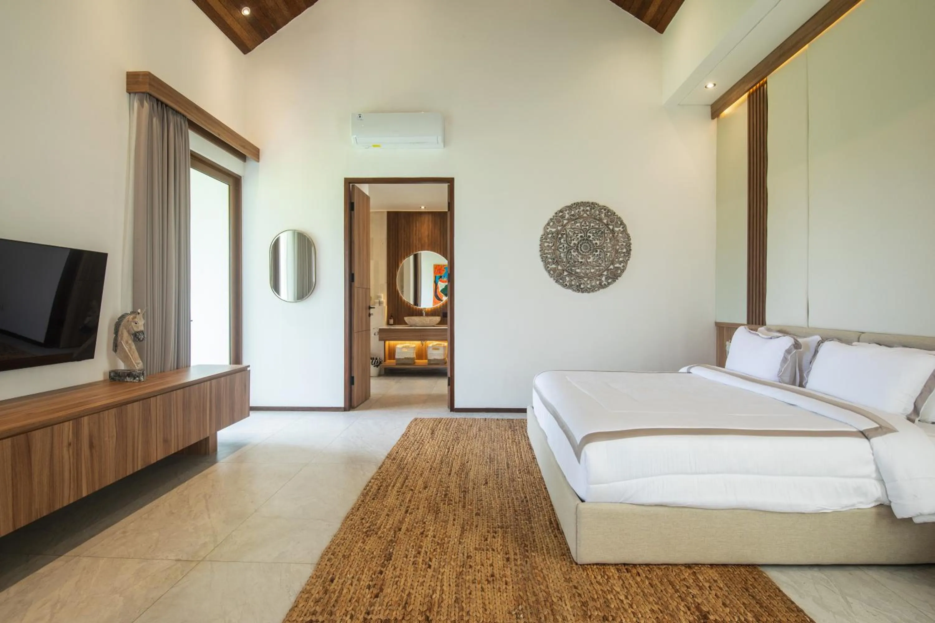 Bed in KammOra Living and Villas