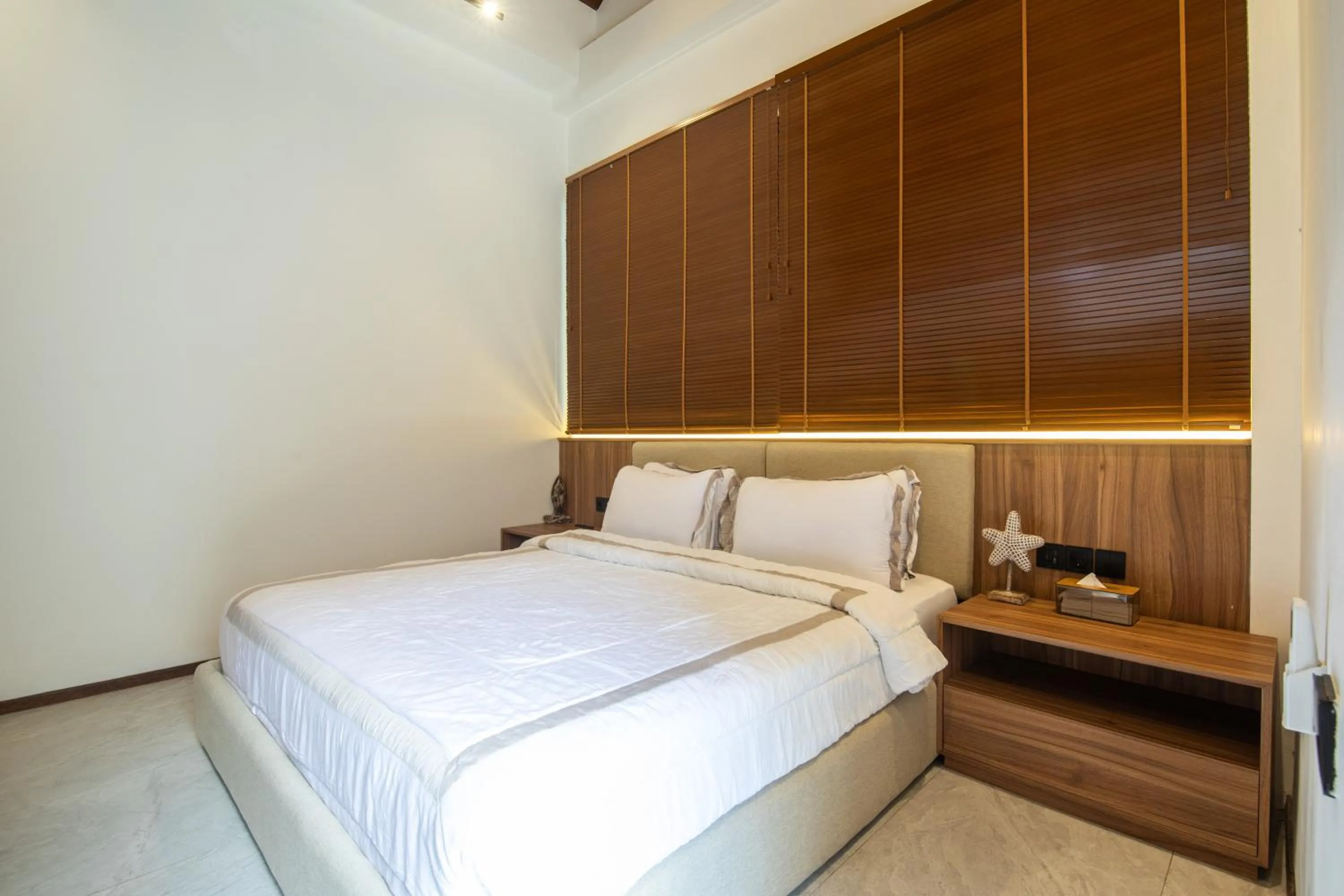 Bed in KammOra Living and Villas