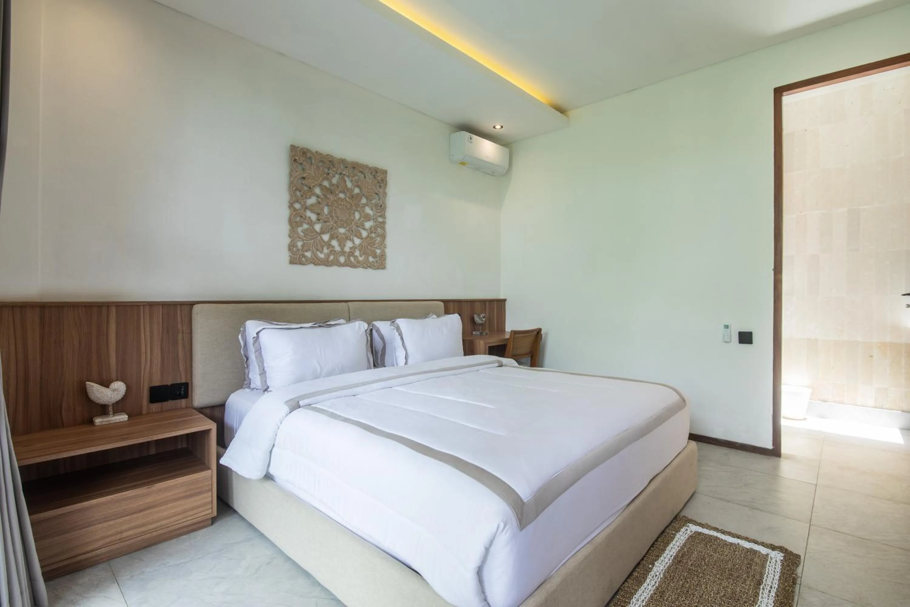 Bed in KammOra Living and Villas