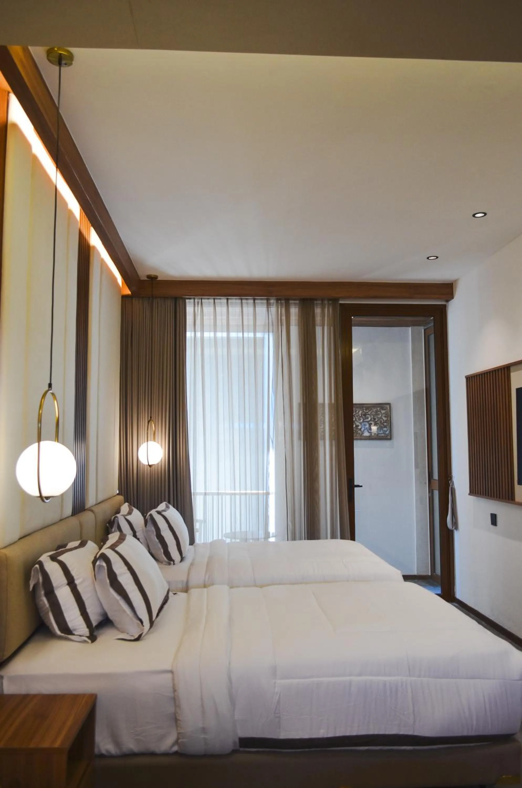 Bed in KammOra Living and Villas