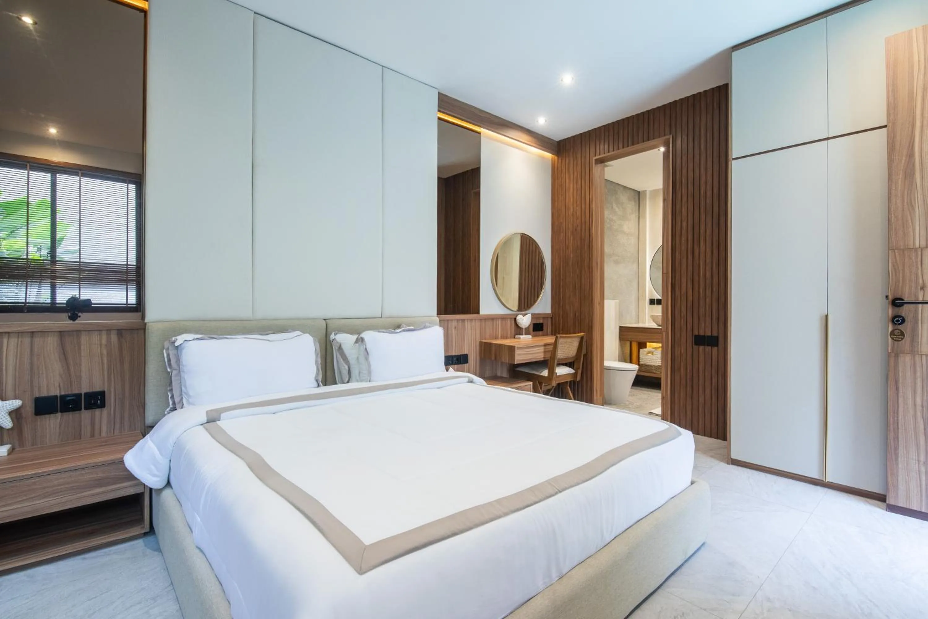 Bed in KammOra Living and Villas