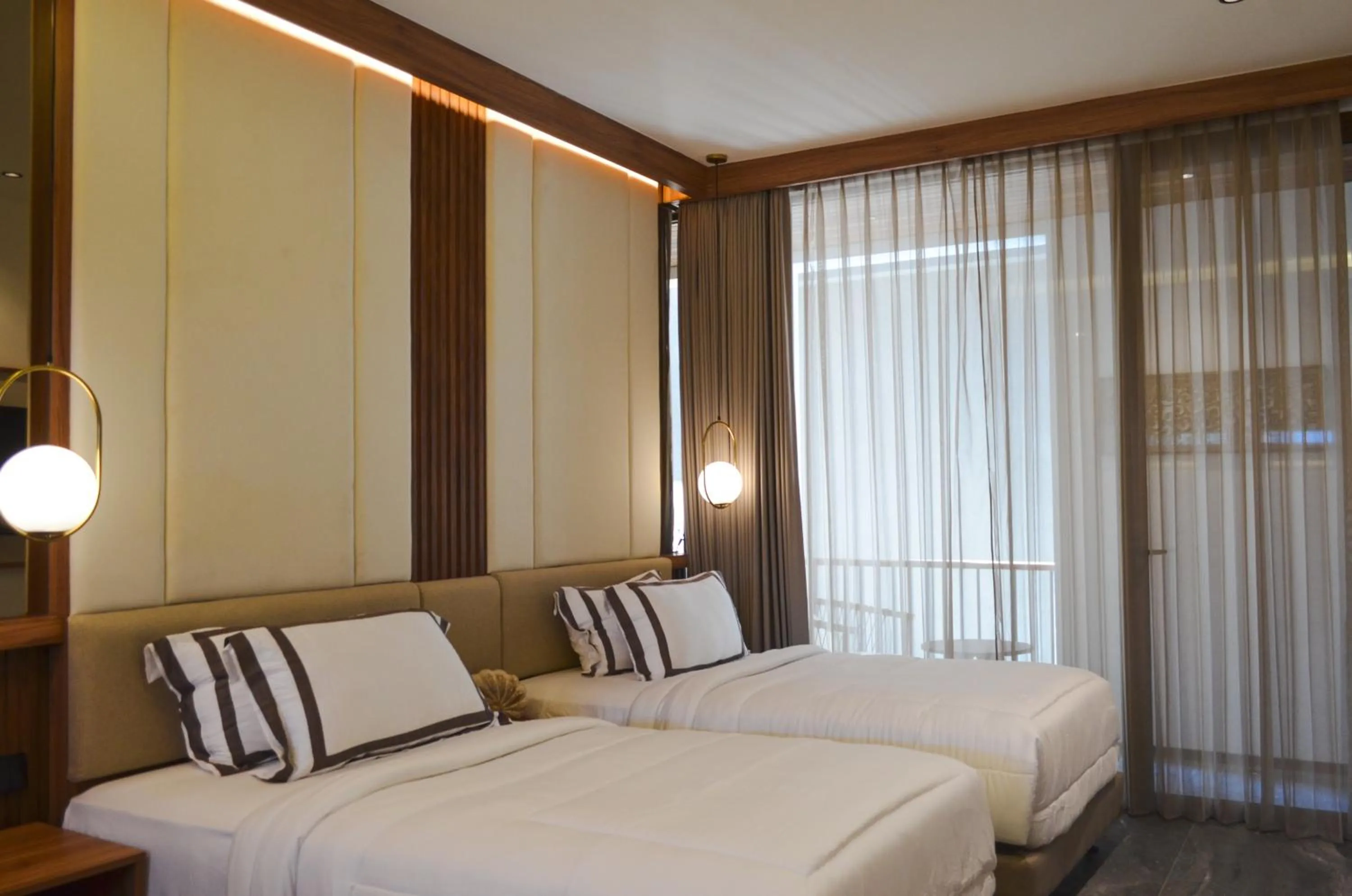 Bed in KammOra Living and Villas