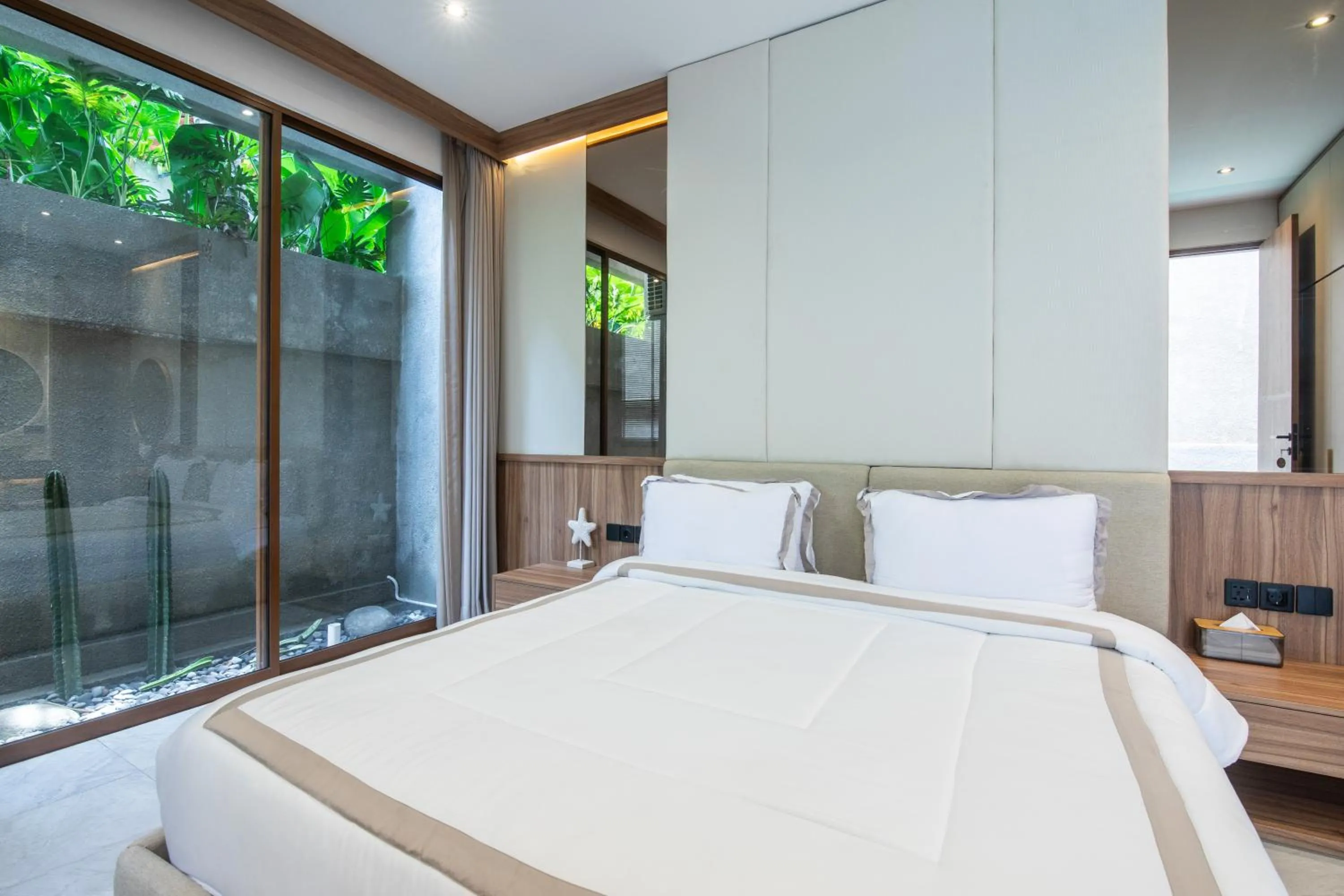 Bed in KammOra Living and Villas