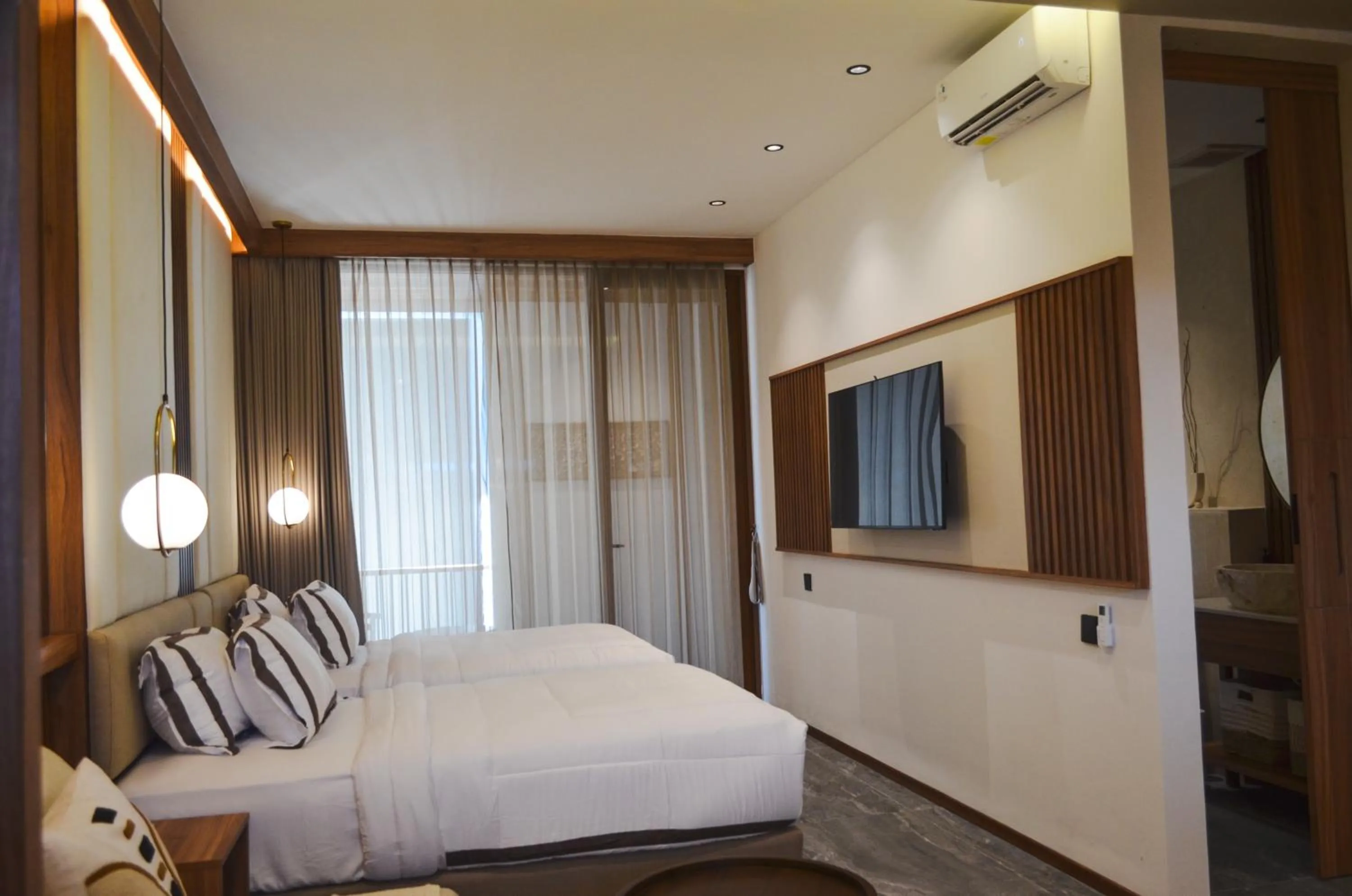 Bed in KammOra Living and Villas