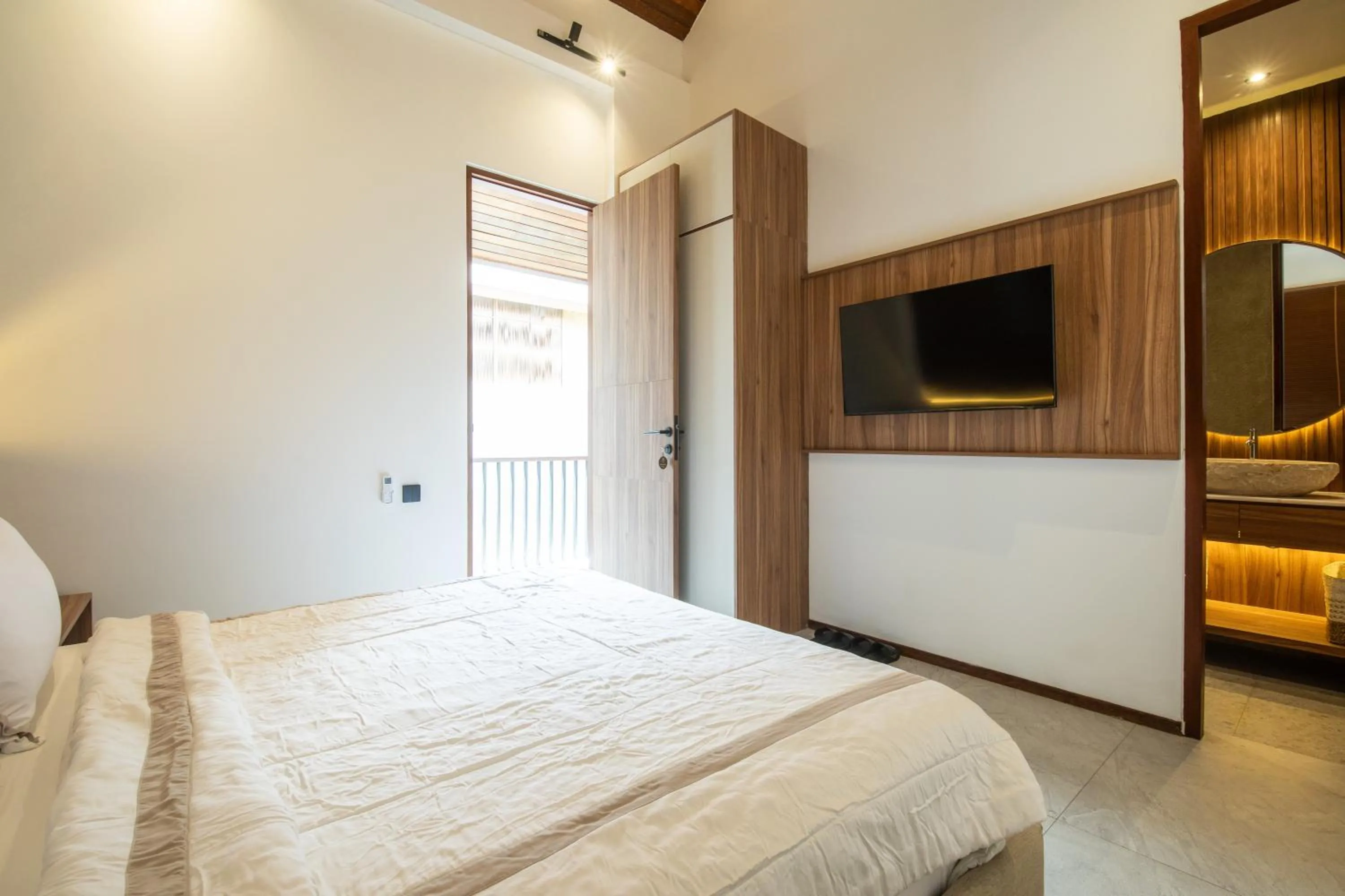 Bed in KammOra Living and Villas