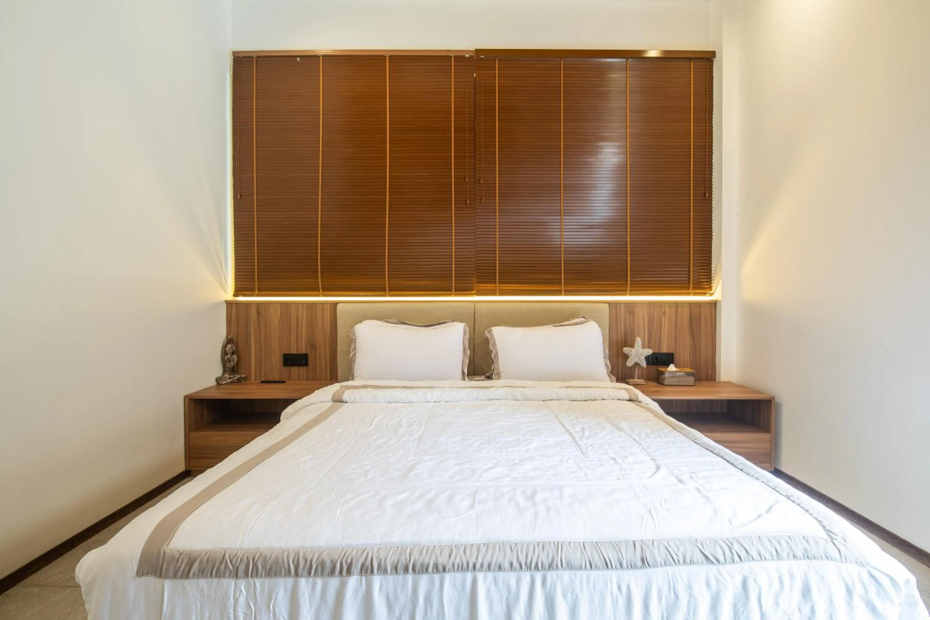 Bed in KammOra Living and Villas