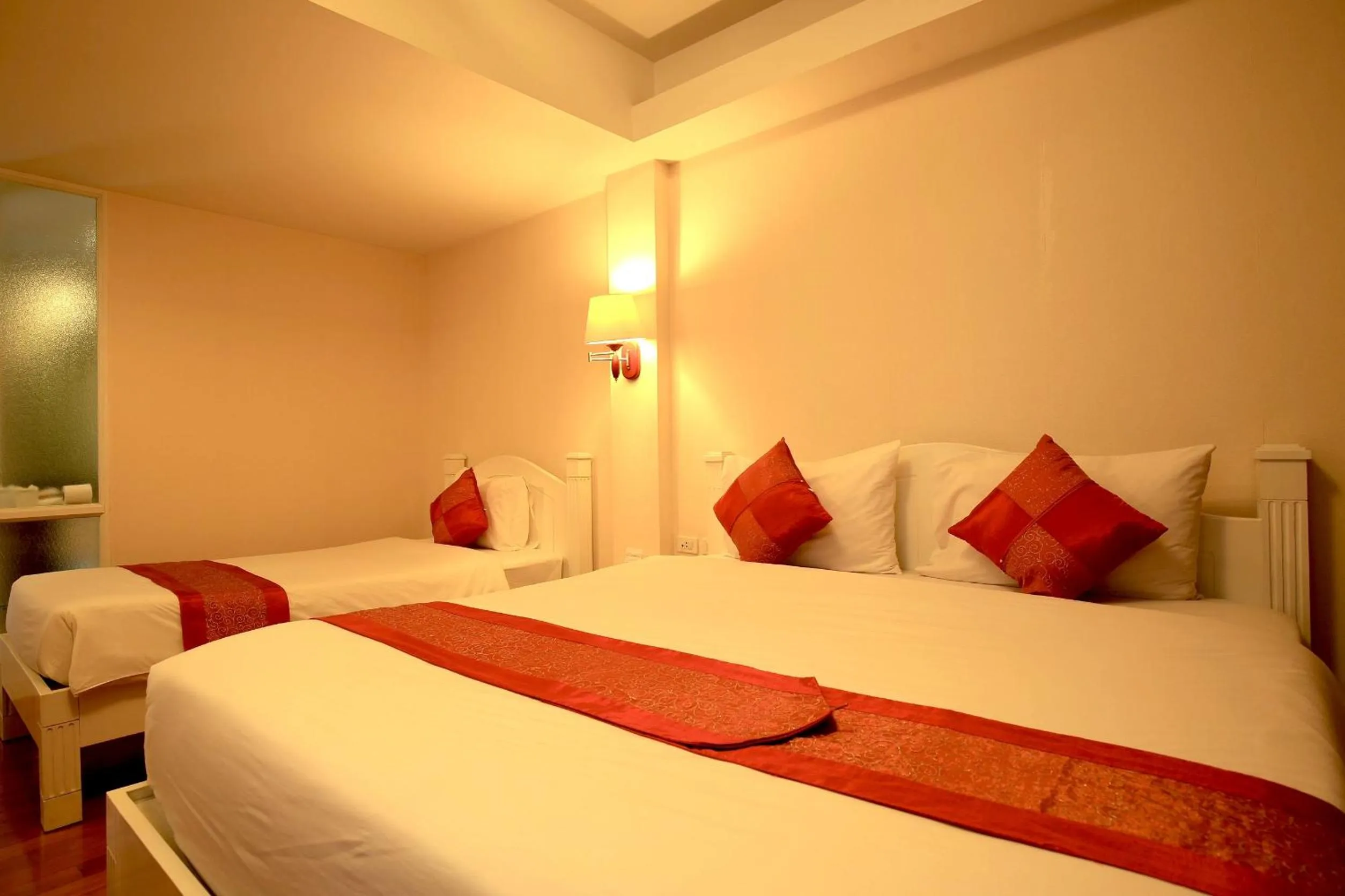 Bed in Grandsmile Wellness Resort