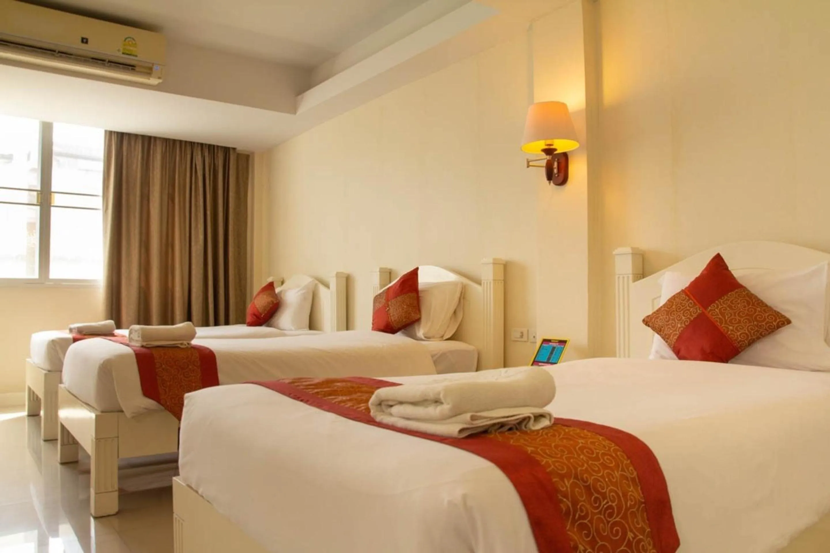 Bed in Grandsmile Wellness Resort