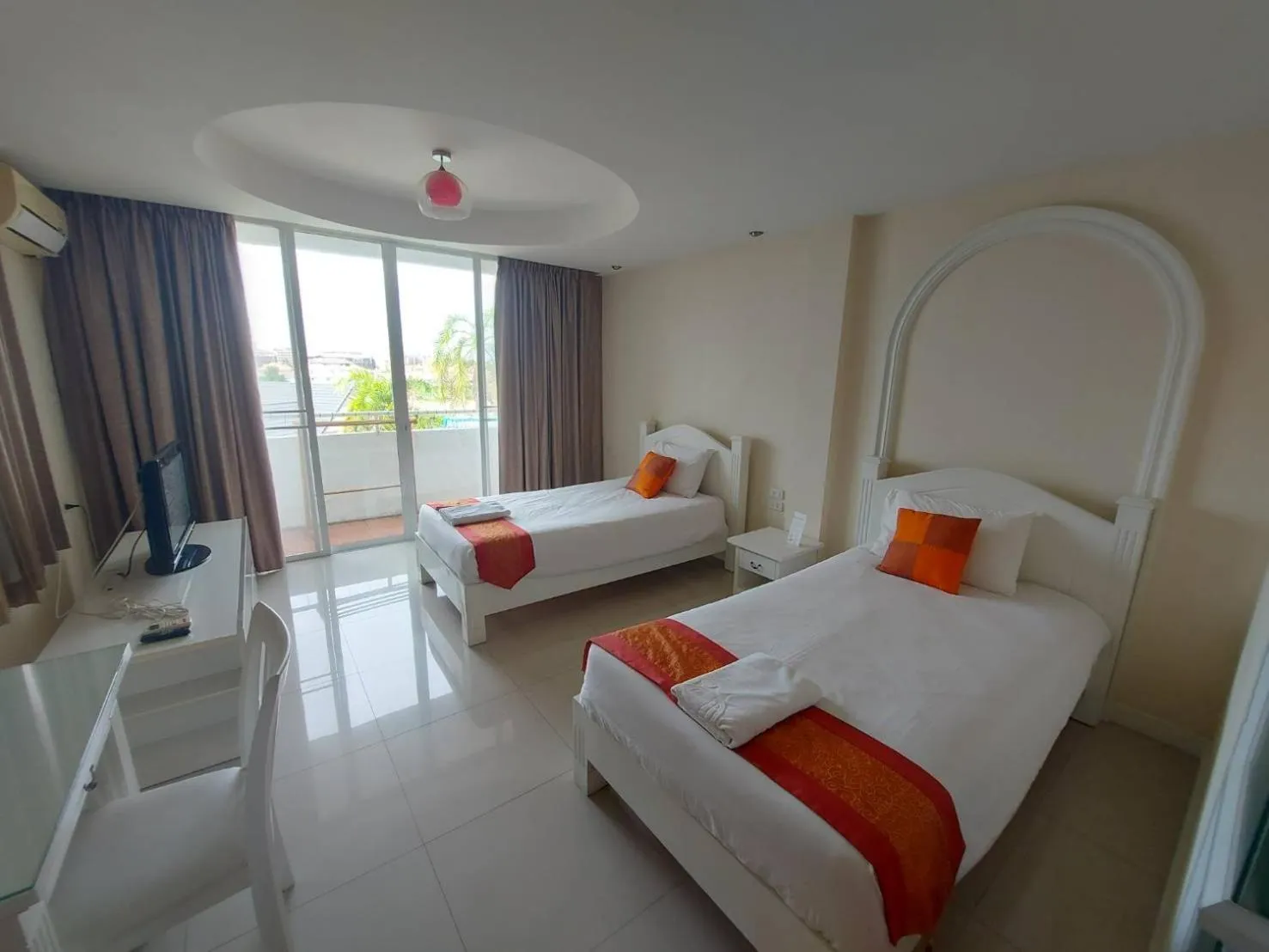 Bed in Grandsmile Wellness Resort