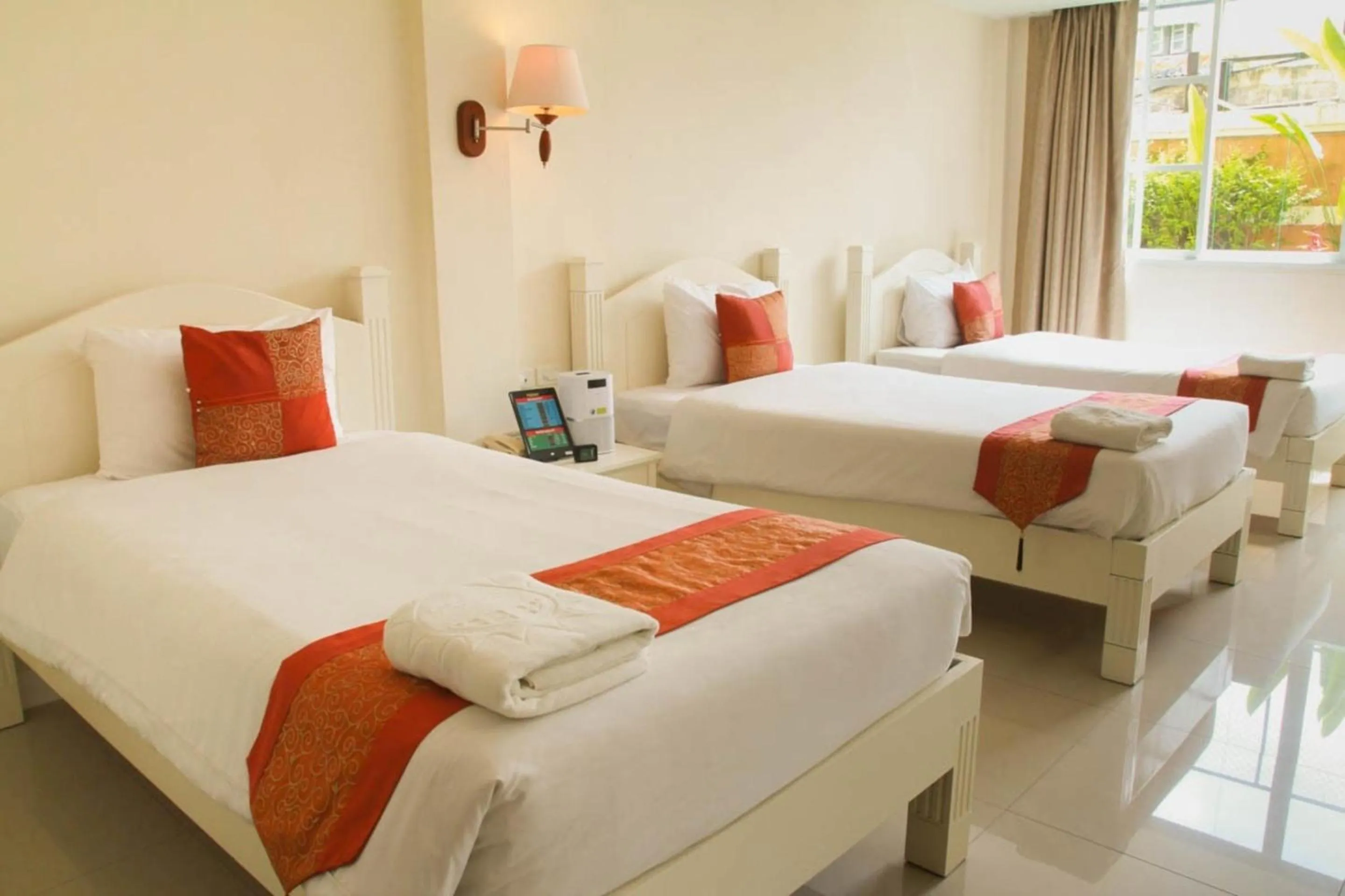 Bed in Grandsmile Wellness Resort