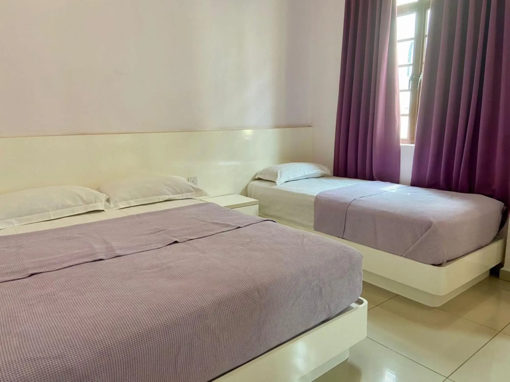 Bed in Lavender Riverside Hotel