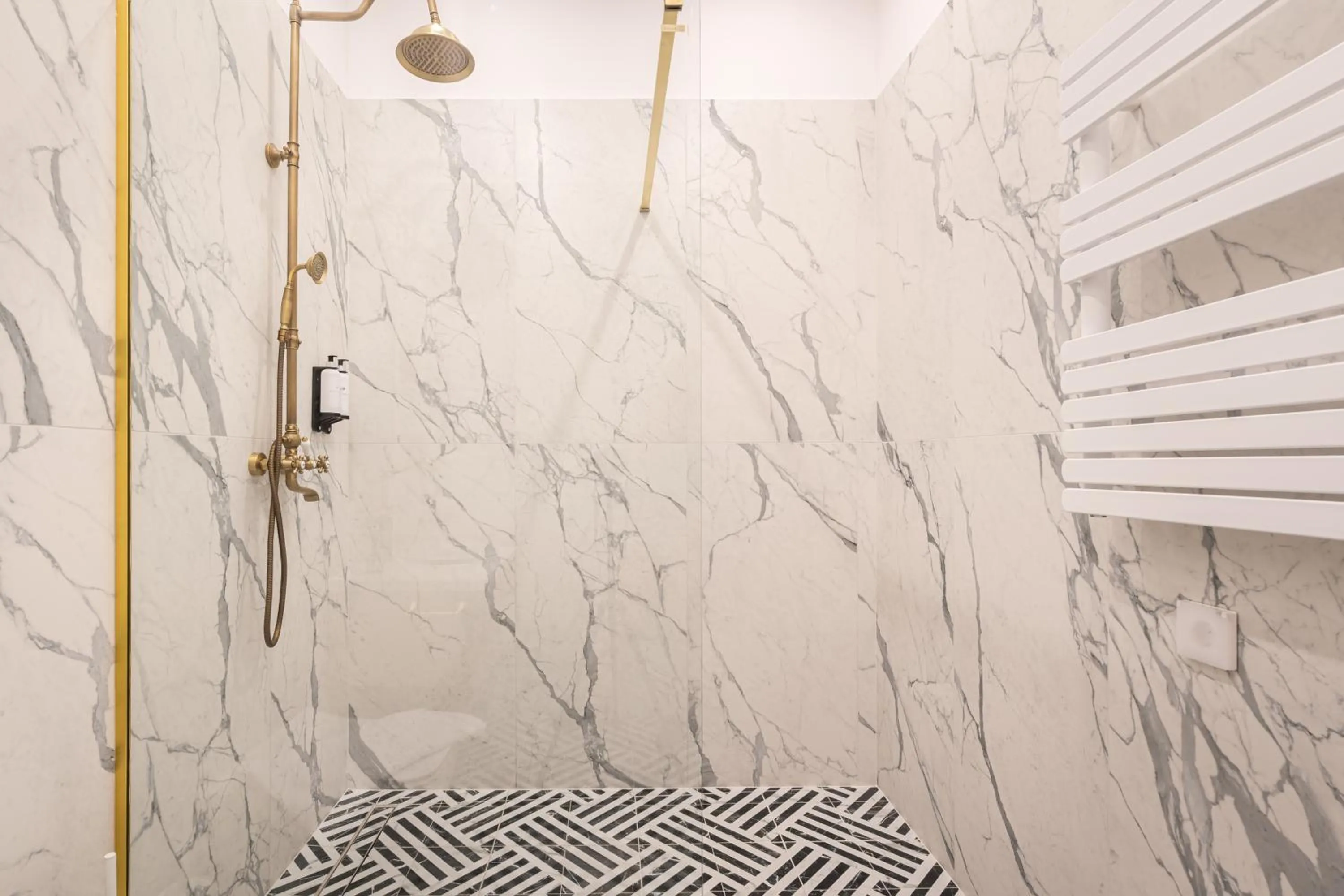 Shower in Timeless Boutique Suites by BQA