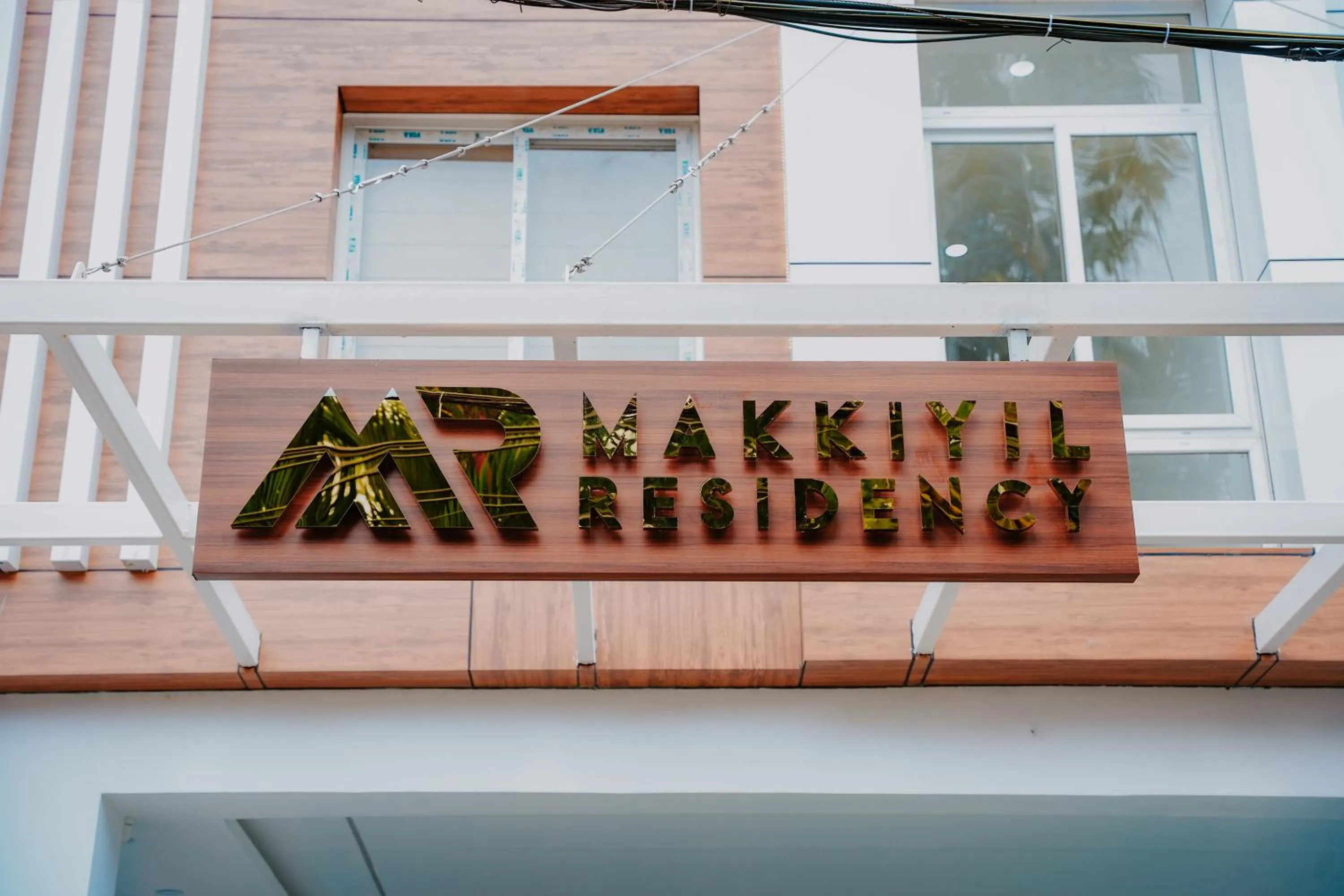 Property logo or sign in Makkiyil Residency